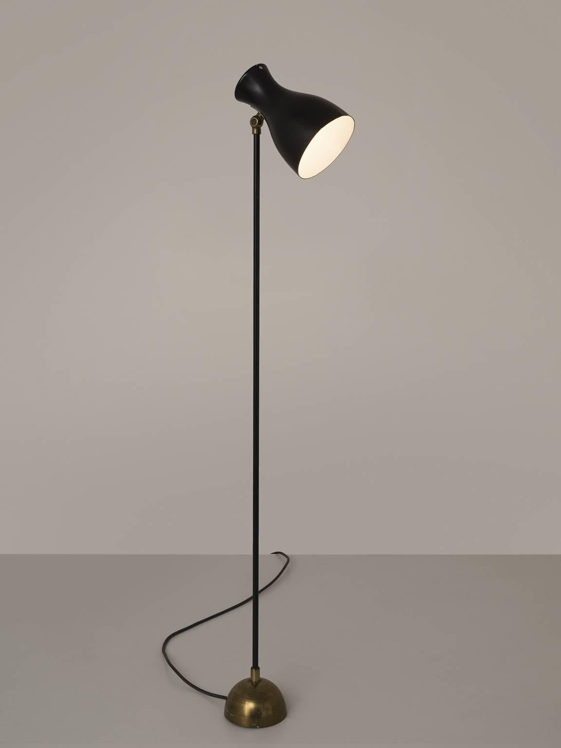 Floor lamp by Schulz for Wohnbedarf AG Schweiz, brass and lacquered metal, cast metal, tubular metal, sheet metal, painted black, Switzerland, 1957.

This delicate and modest floor lamp is designed by Schulz for Wohnbedarf AG Schweiz. The lamp,