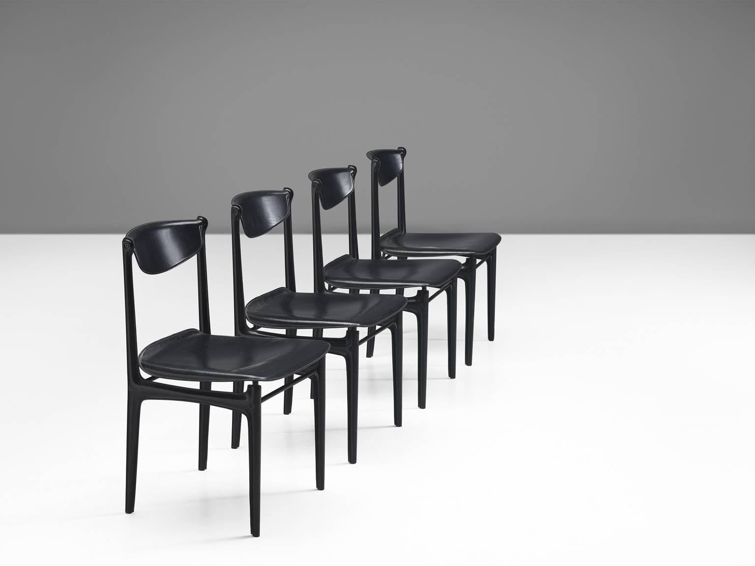 Set of four chairs by Matteo Grassi in leather and metal, Italy, 1960s.

Delicate set of four leather dining chairs. These chairs consist of a metal frame wrapped in black leather. The frame is modest and frail. With the leather 'upholstery', the