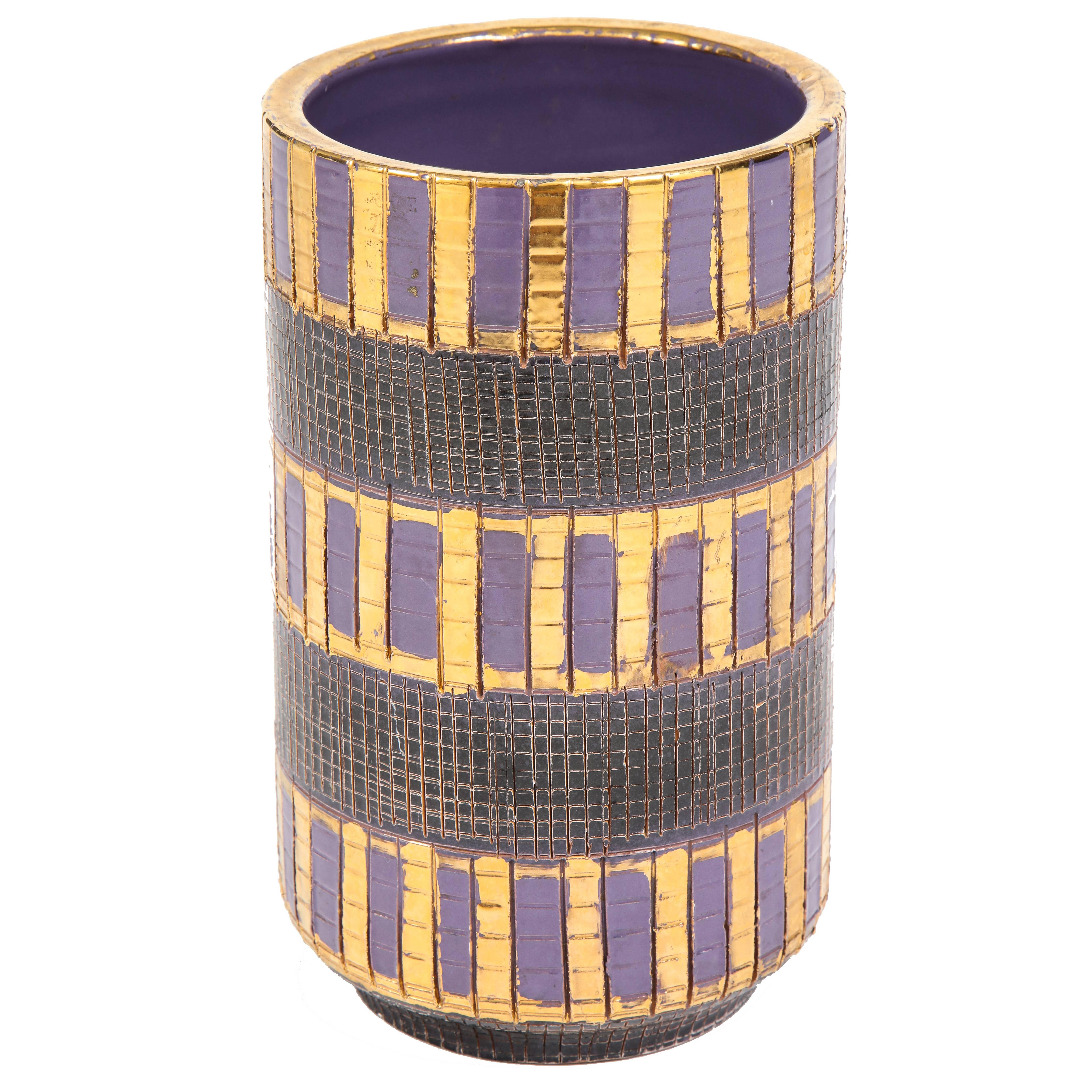 Aldo Londi Bitossi seta vase, ceramic, gold, purple and black, signed. Medium scale chunky vase with black glazed sgraffito sections combined with patterns of alternating gold and purple bands. Vase tapers to a footed base. Signed on bottom of vase: