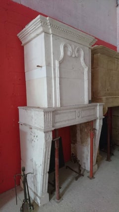 18th Century Louis XVI Stone Fireplace with Trumeau and Geometric Design, France