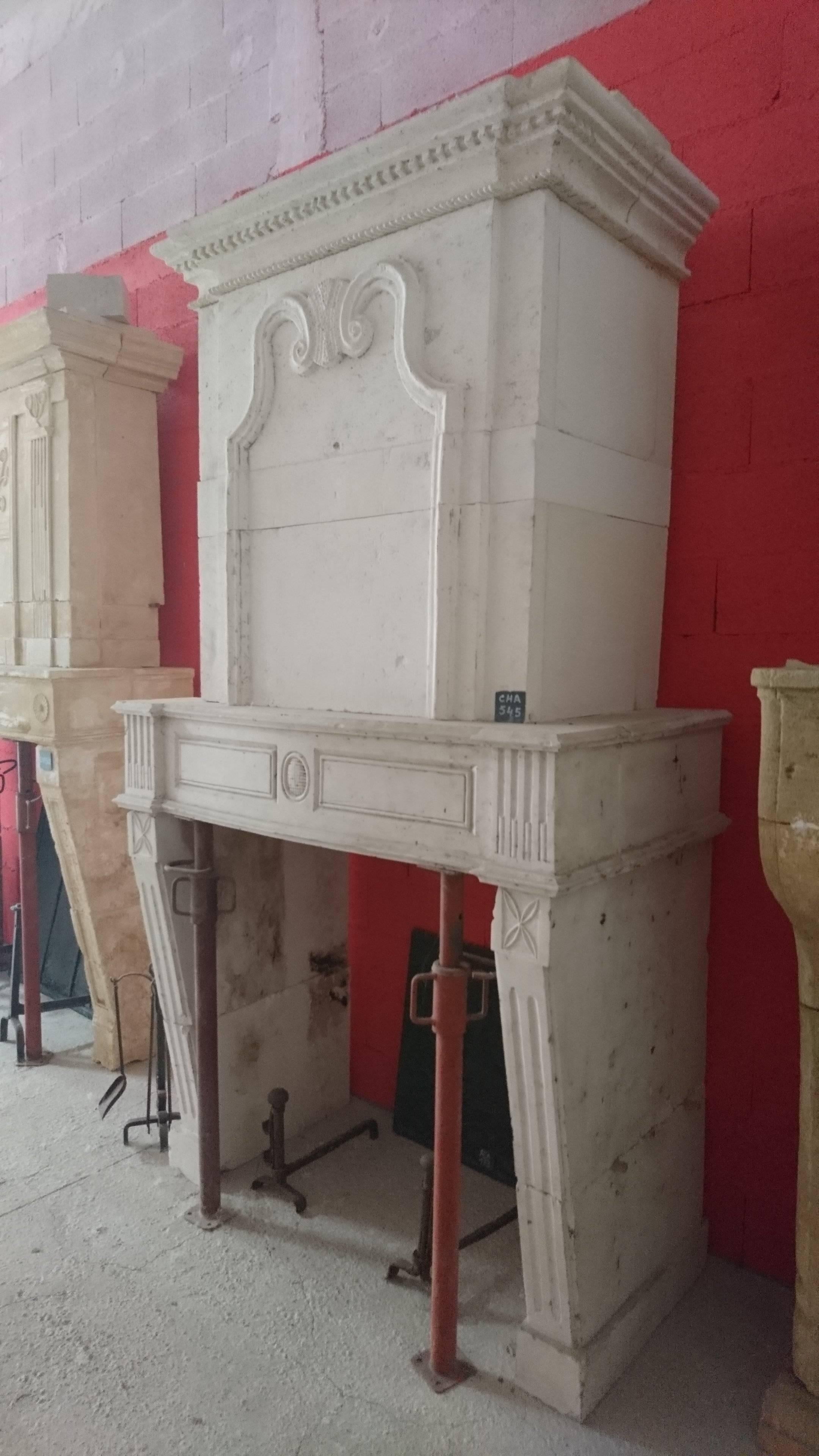 French 18th Century Louis XVI Stone Fireplace with Trumeau and Geometric Design, France For Sale