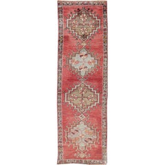 Tribal Geometric Vintage Turkish Oushak Runner with Medallions on Red Background