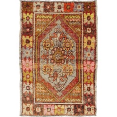 Colorful Vintage Turkish Small Oushak With Floral Medallion and Border