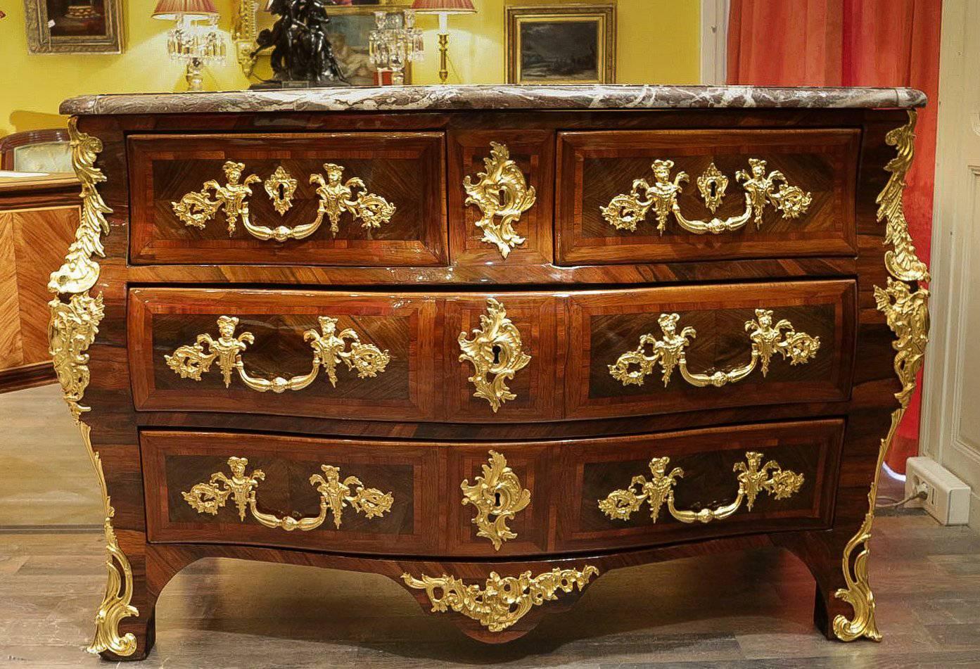 We are pleased to present you an amazing, beautiful, elegant and rare French Louis XV period marble top commode with four-drawer serpentine and bombe chest with multi wood inlay and magnificent gilt bronze mounts.
Maker monogram stamp and JME on