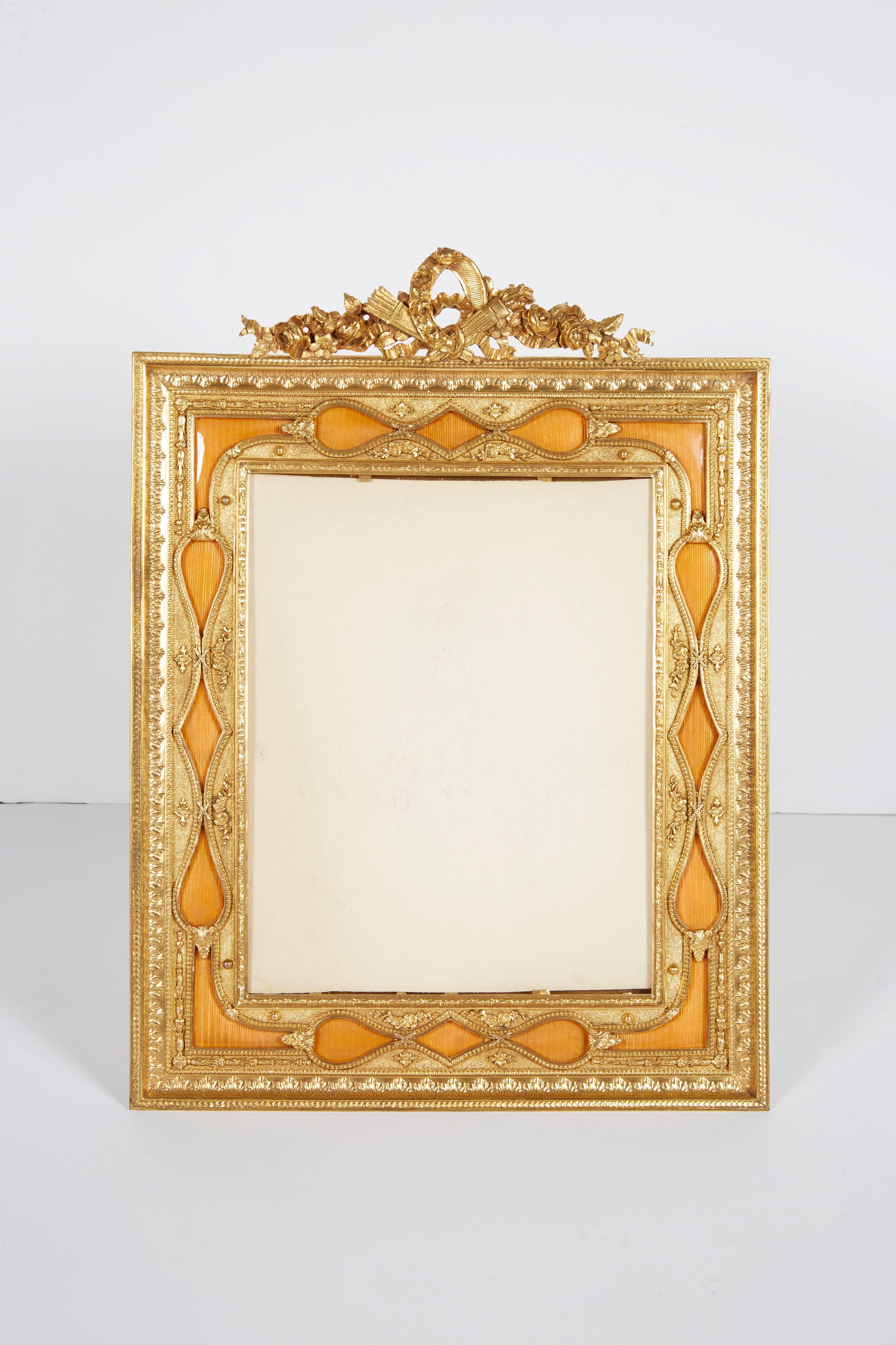 A large French gilt bronze ormolu and orange guilloche enamel picture photo frame, 19th century.

Frame size: 16 x 11 inches.

Excellent condition.

Ready for use.