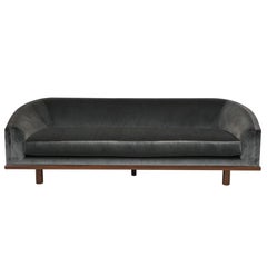 NK Curved Sofa Upholstered in Velvet with a Walnut Exposed Base