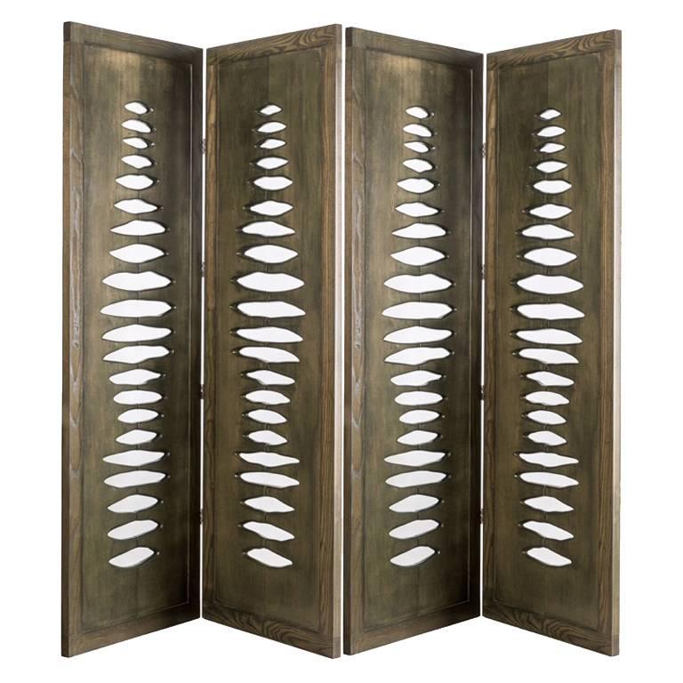 This sculptural space divider was inspired by images of primitive forms and vertebrae. Each panel stands approximately 77