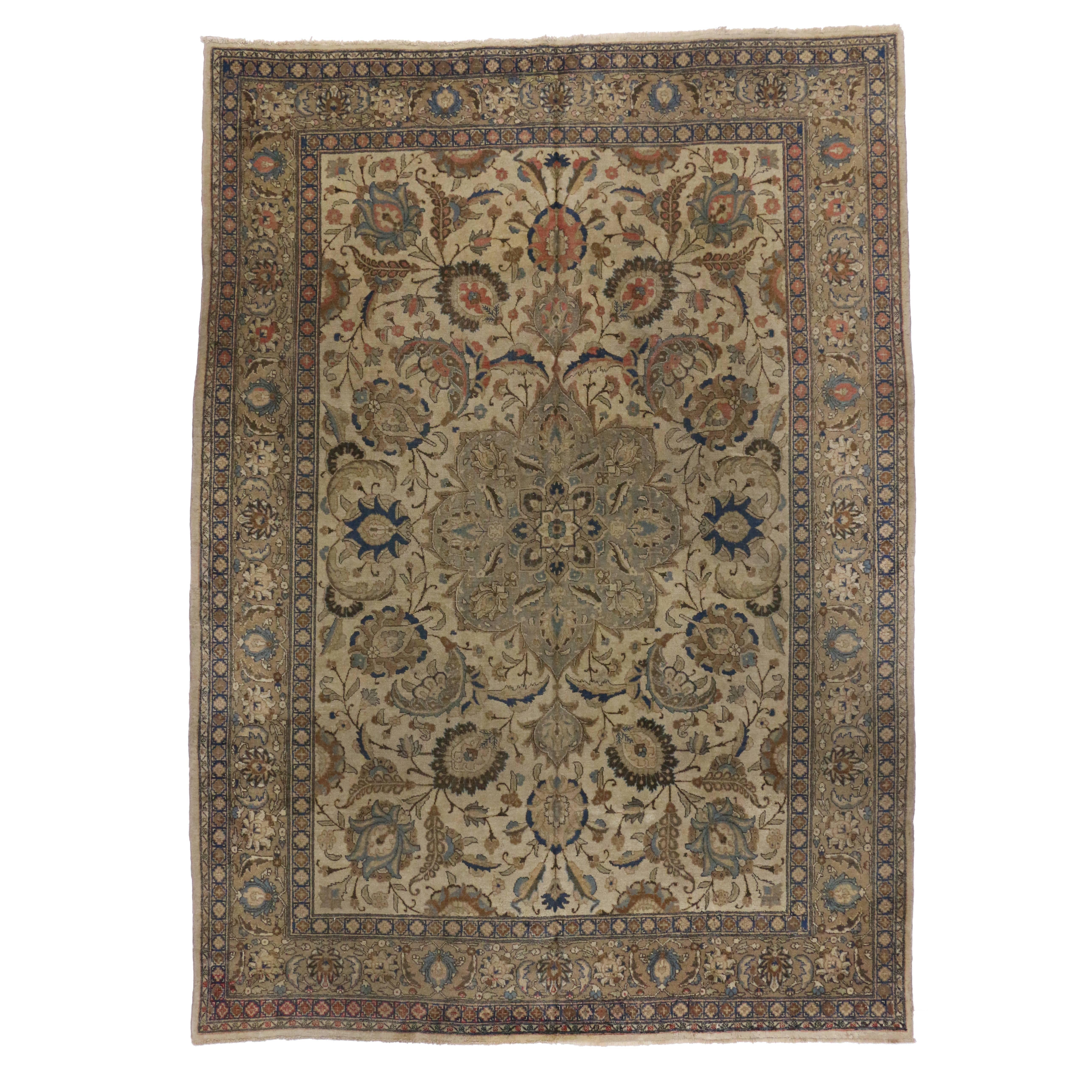 Distressed Antique Persian Tabriz Area Rug with Traditional Style For Sale