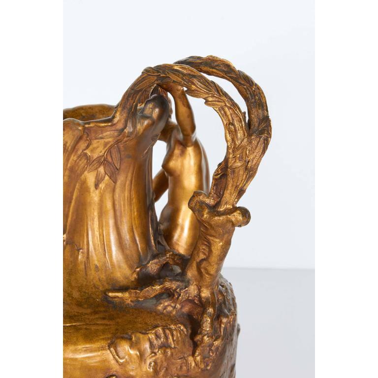 An Art Nouveau gilt bronze lobed ewer by Alexandre Vibert (French, 1847-1909), produced within the early 20th century period, depicting a classical nude female figure on the bank of a body of water. Markings include signature “A.Vibert”.
