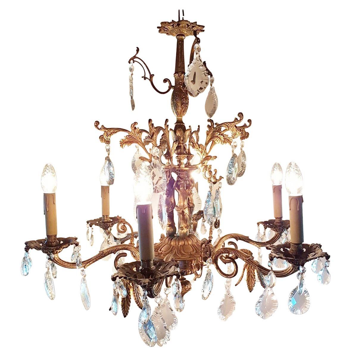 Spanish Chandelier with Nine Lights, Three Small Kids on the Frame, Mid-1900 For Sale