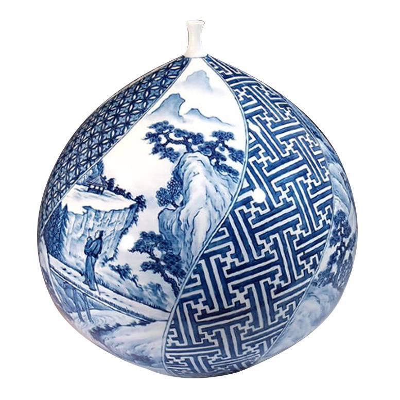 Striking contemporary Imari decorative porcelain vase in blue and white, hand-painted on a beautifully shaped ovoid body, a signed masterpiece by Kinsai, highly acclaimed award-winning master porcelain artist in the traditional patterns and designs
