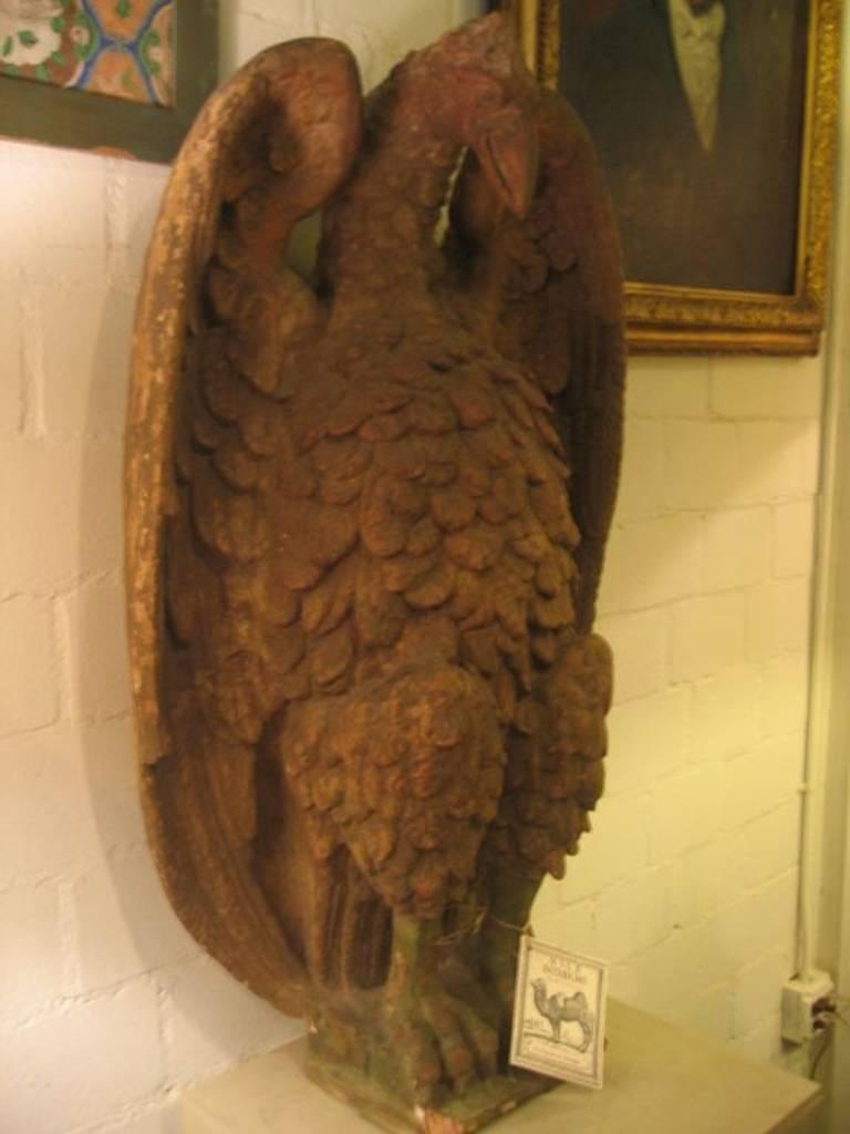 Pair of French 18th century terra cotta eagle sculptures.