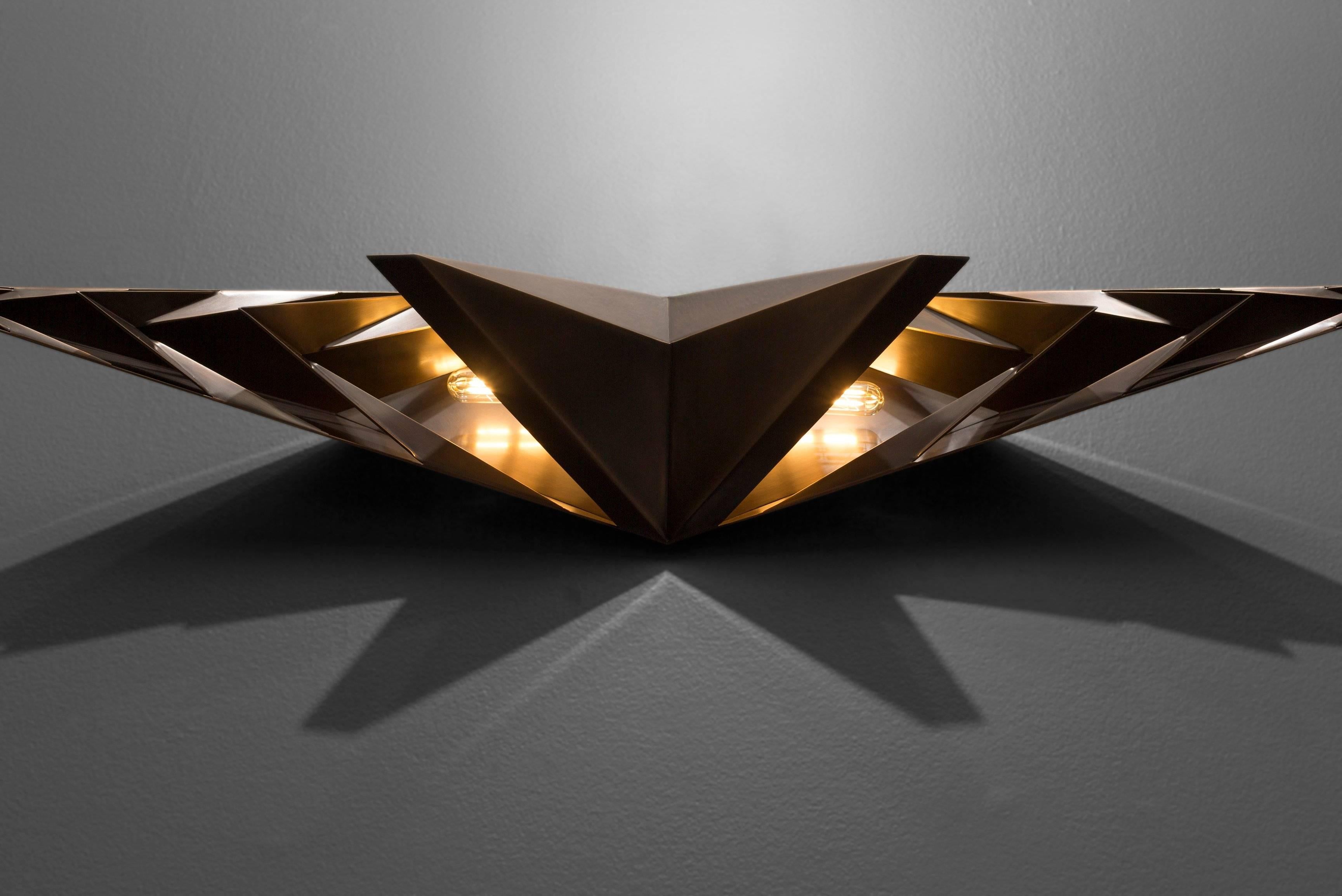 Parenthetical light was included in Bellevue Art Museum's 2016 Biennial: Metalmorphosis, along with work selected by a distinguished national jurors of 49 metalsmiths from the Pacific Northwest. This sconce, which was designed as a centrepiece in a