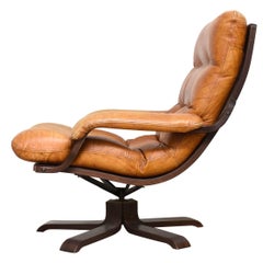 Pair Nordic Cognac Leather Swivel Lounge Chairs