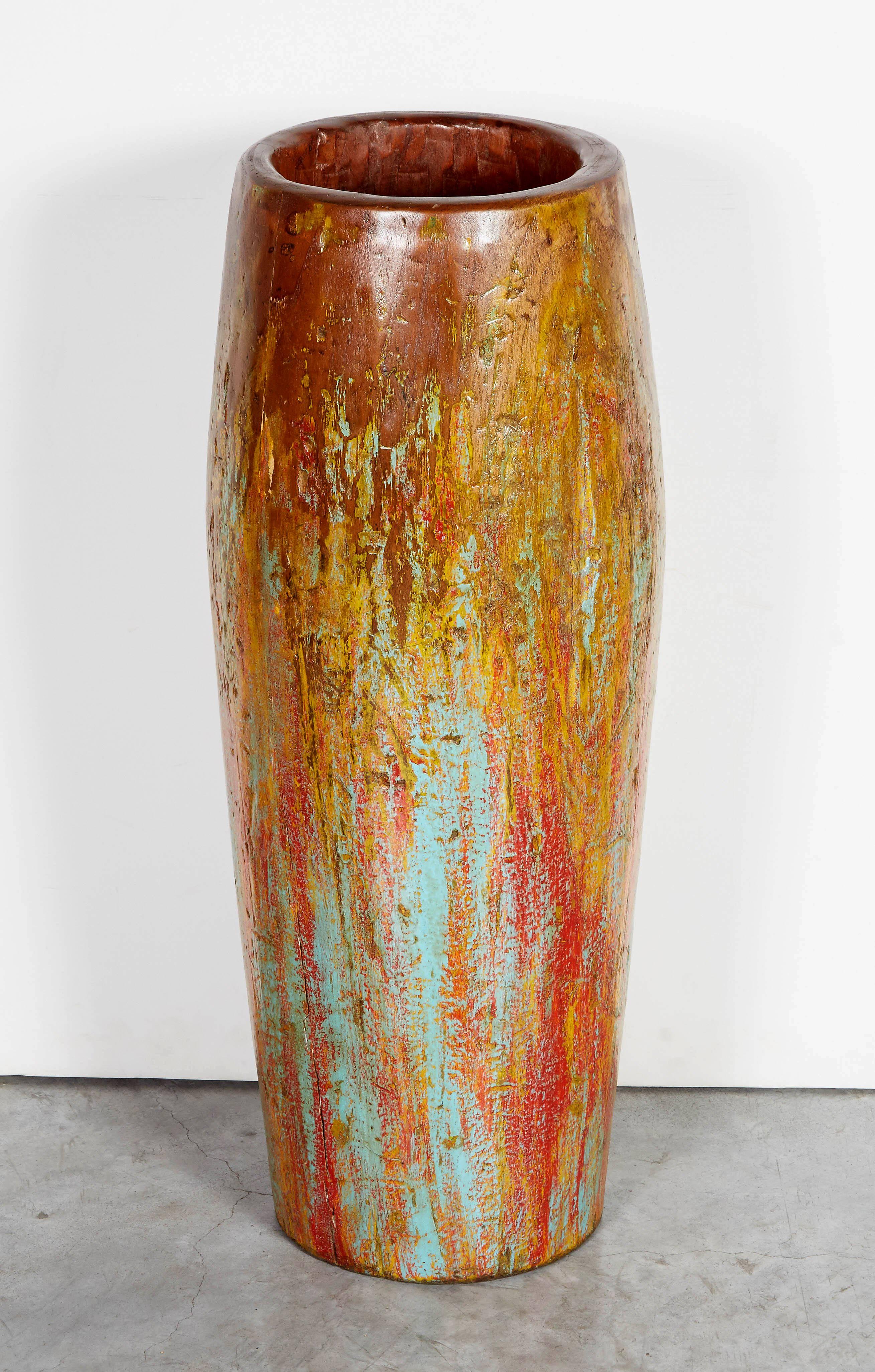 A tall, gracefully shaped and warmly colored vase made from a vintage drum base carved from a single piece of teak wood. From Java, Indonesia, circa 1950.
M2016.