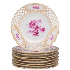 Eight Meissen Reticulated Painted Floral Motif Plates, in a Rose Palette