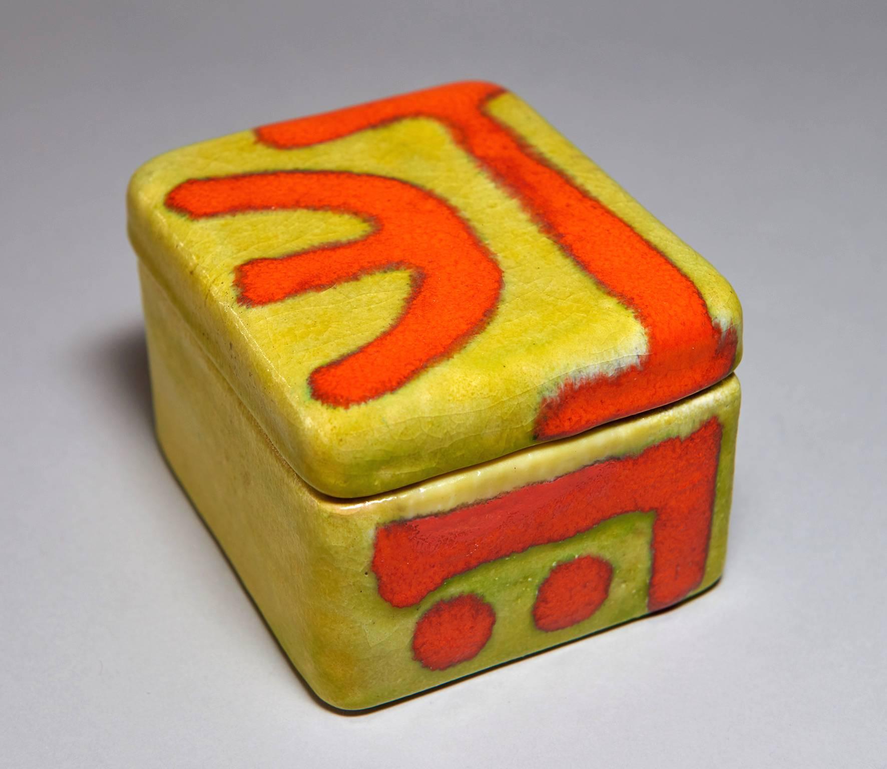 This boldly glazed, covered ceramic box was made by Italy's foremost post-war ceramist -- Guido Gambone -- in his Florence, Italy atelier in the 1950s. It can be used to house jewelry, candies, nuts, cigarettes, keys, and the like. Signed GAMBONE