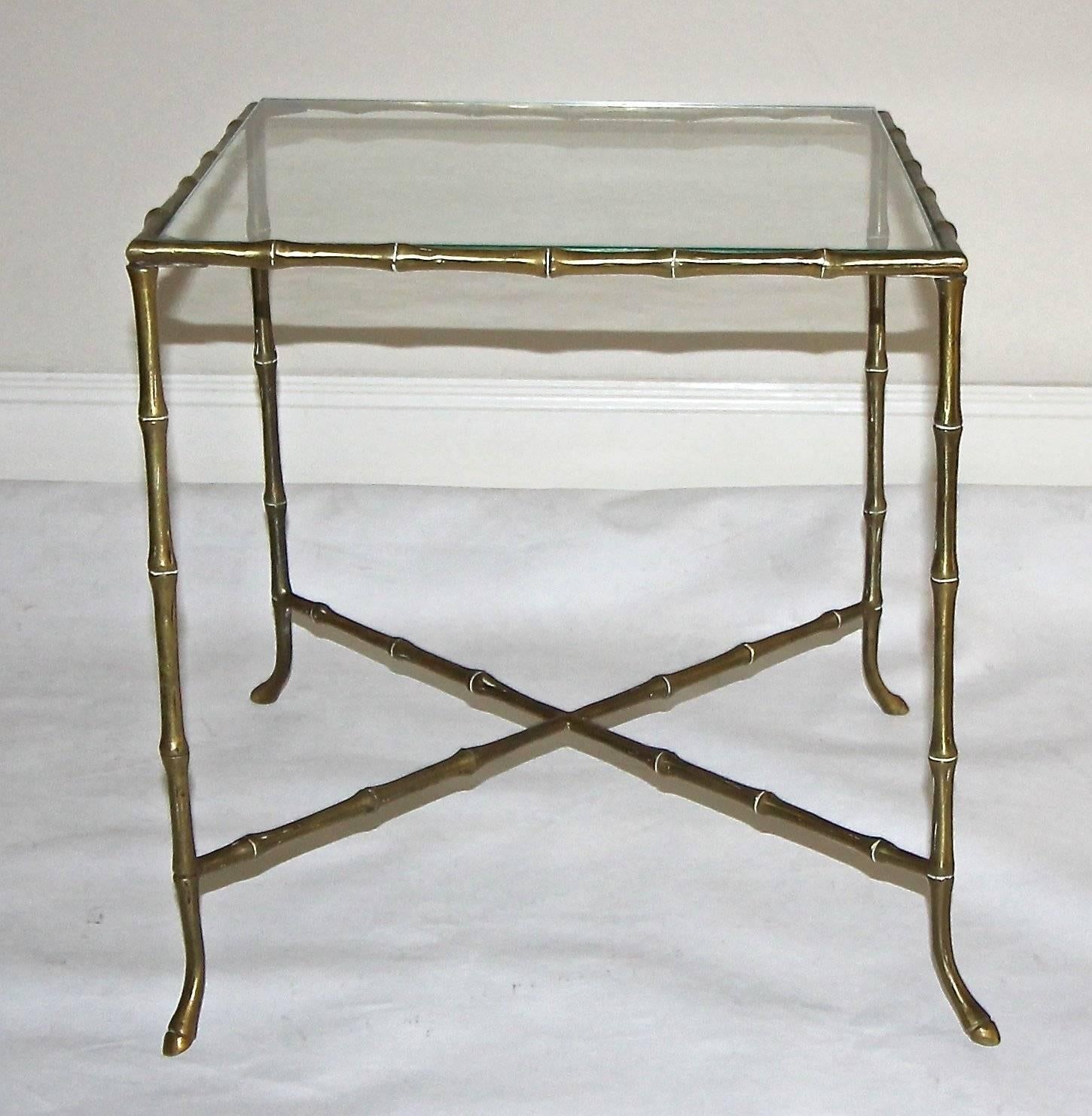 French faux bamboo  brass or bronze side or end table in the style of Maison Baguès. Inset glass top. Great overall patina.

16" H X 16" W X 16" D