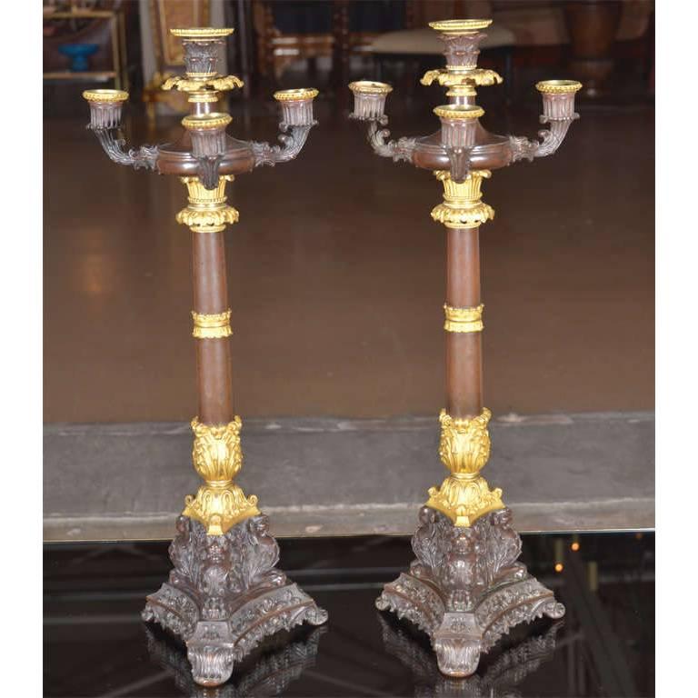 Magnificent pair gilt doré bronze 4 light Empire style candelabras. Very well crafted and intricately detailed. Extremely heavy. Late 19th or early 20th century.

21-1/2" H X 8" diameter.