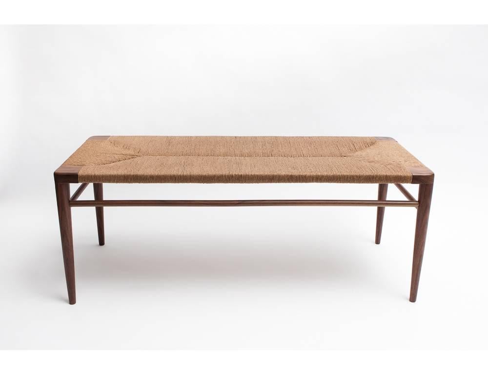 Originally designed in 1956 by Mel Smilow, this RLB 44 walnut and rush bench was re-issued by his daughter, Judy Smilow, and launched by reGeneration in 2013. Available in other sizes and finish combinations. Made in the USA, since 1949.  
