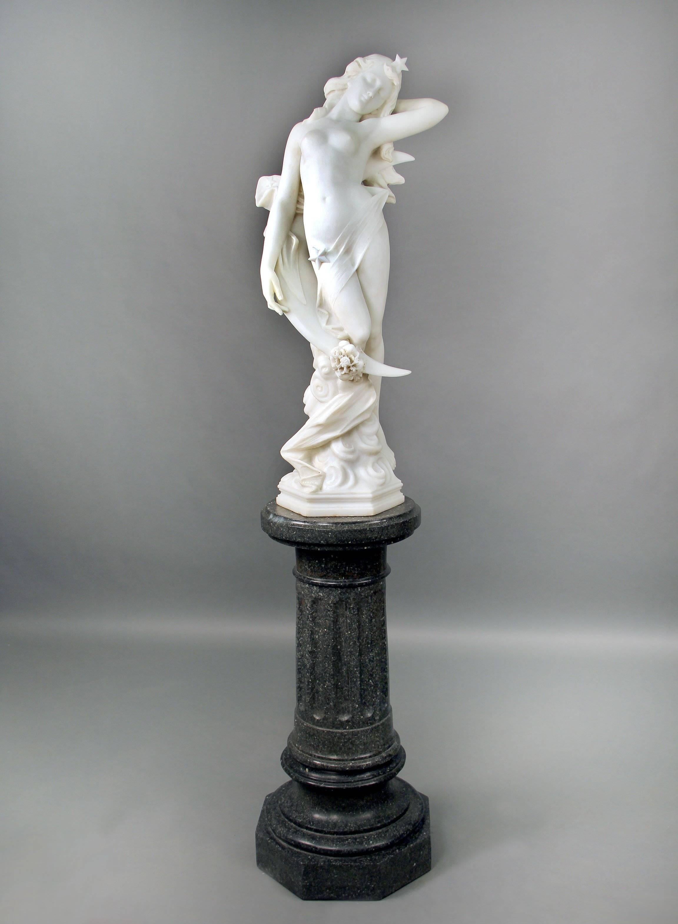 A lovely late 19th century Italian white carrara marble of a nude woman on a pedestal entitled 