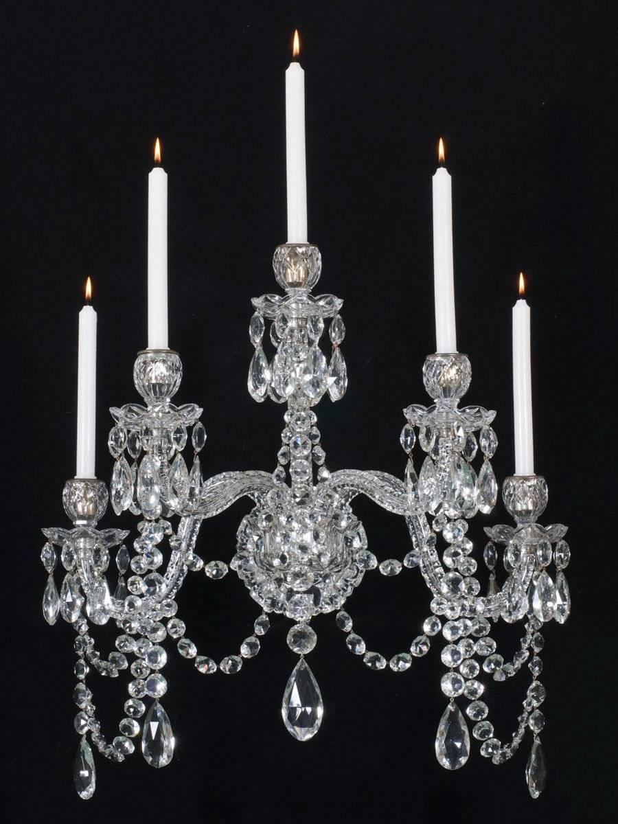A highly important set of four cut-glass silver-plated wall lights by F&C OSLER. The central arm plate supporting five thumb cut candle arms arranged on three different levels these arms surmounted with flat diamond cut drip pans and egg shaped