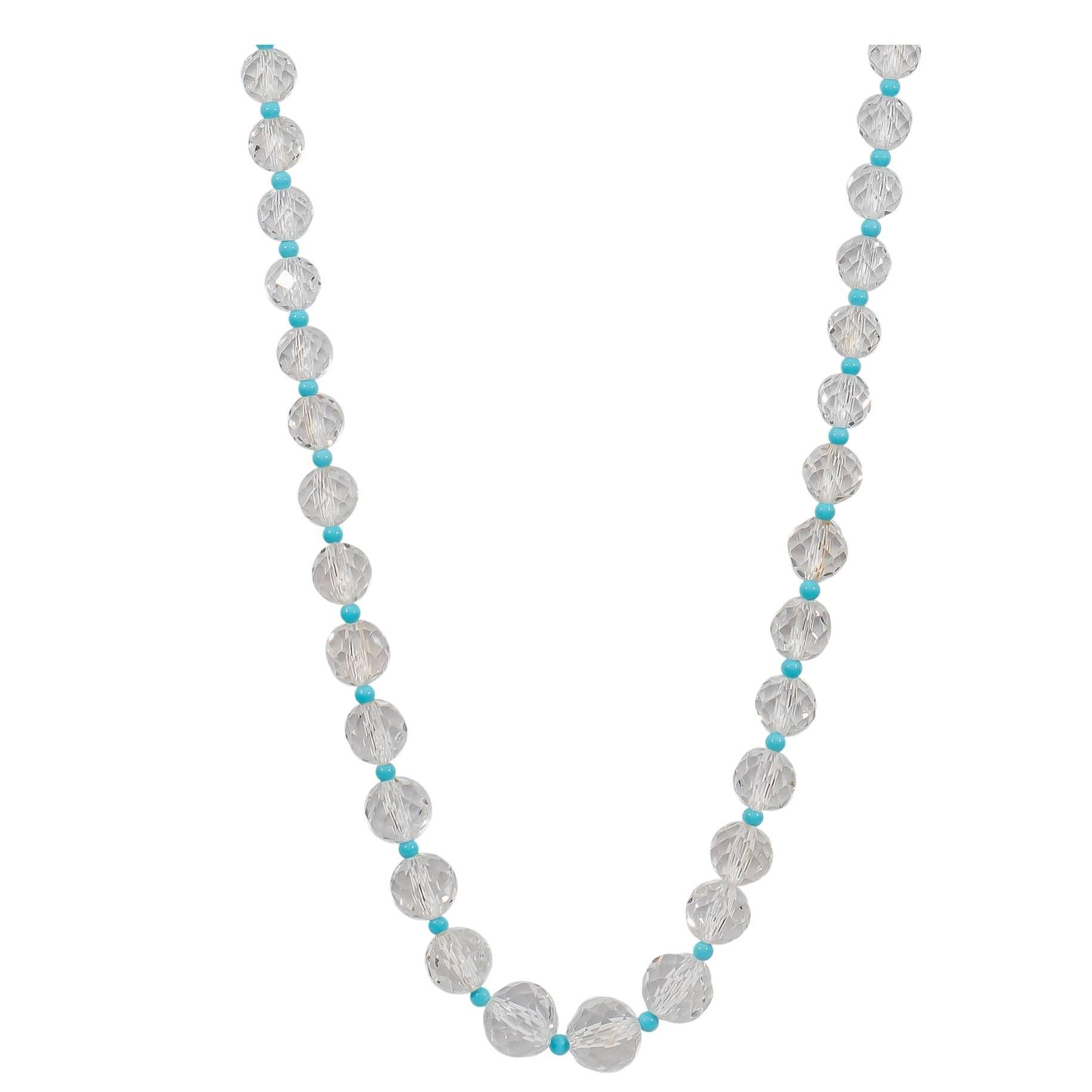 Beautiful necklace featuring crystal and Sleeping Beauty turquoise beads finished with Naomi Sarna's signature 18K yellow gold and VS-FG white diamond clasp.

The crystals graduate from 6.5mm to 14mm in diameter. The turquoise beads are 4 mm in