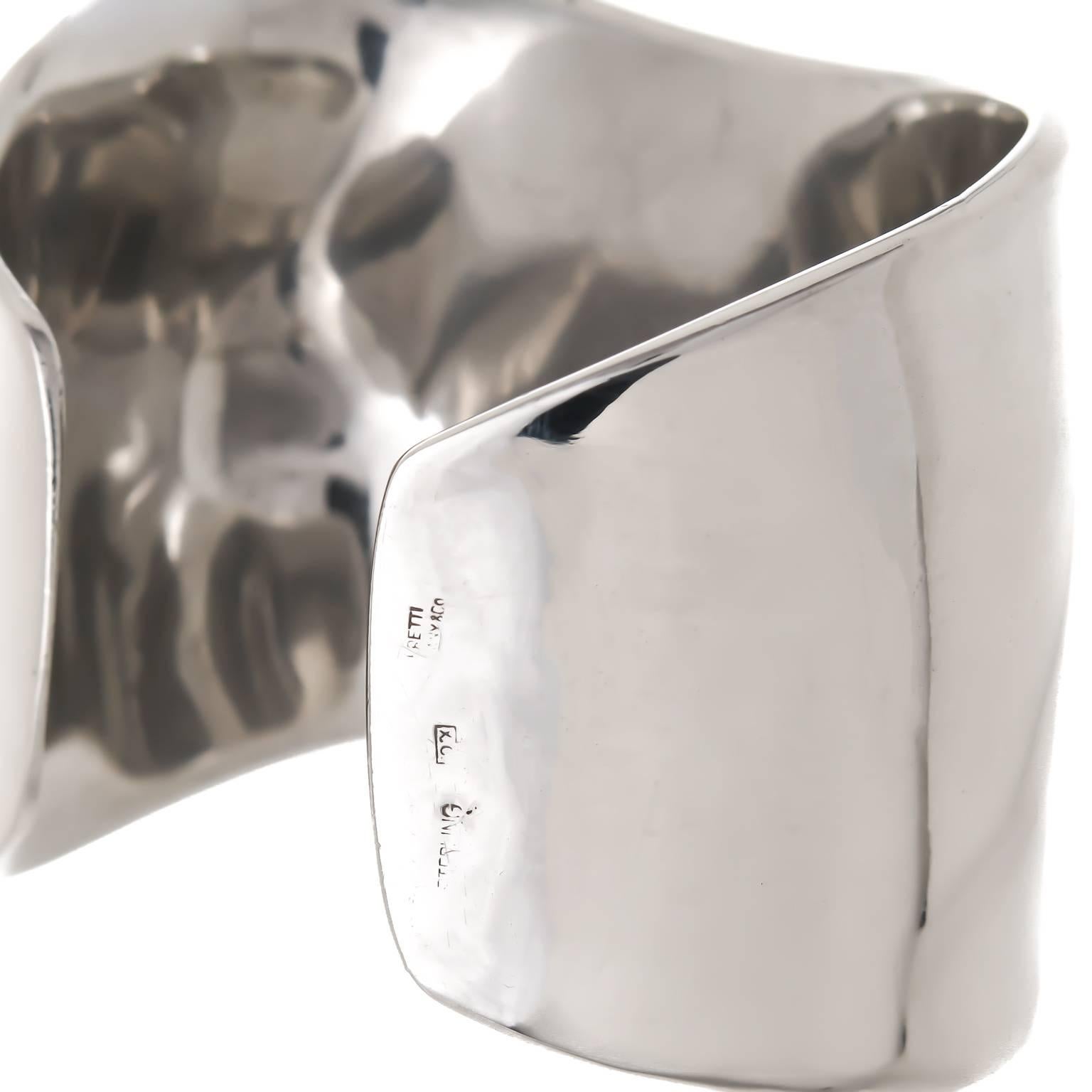 Circa 1990s Elsa Peretti for Tiffany & Company Bone Cuff Bracelet, measuring 1 1/2 to 2 inch wide, adjustable opening to fit most wrists. Comes in Original Tiffany pouch.