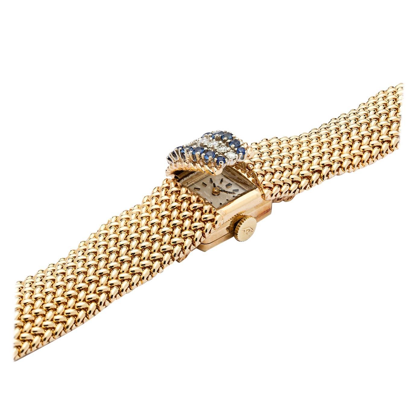 Movado Lady's Yellow Gold Diamond Sapphire Hidden Dial Wristwatch