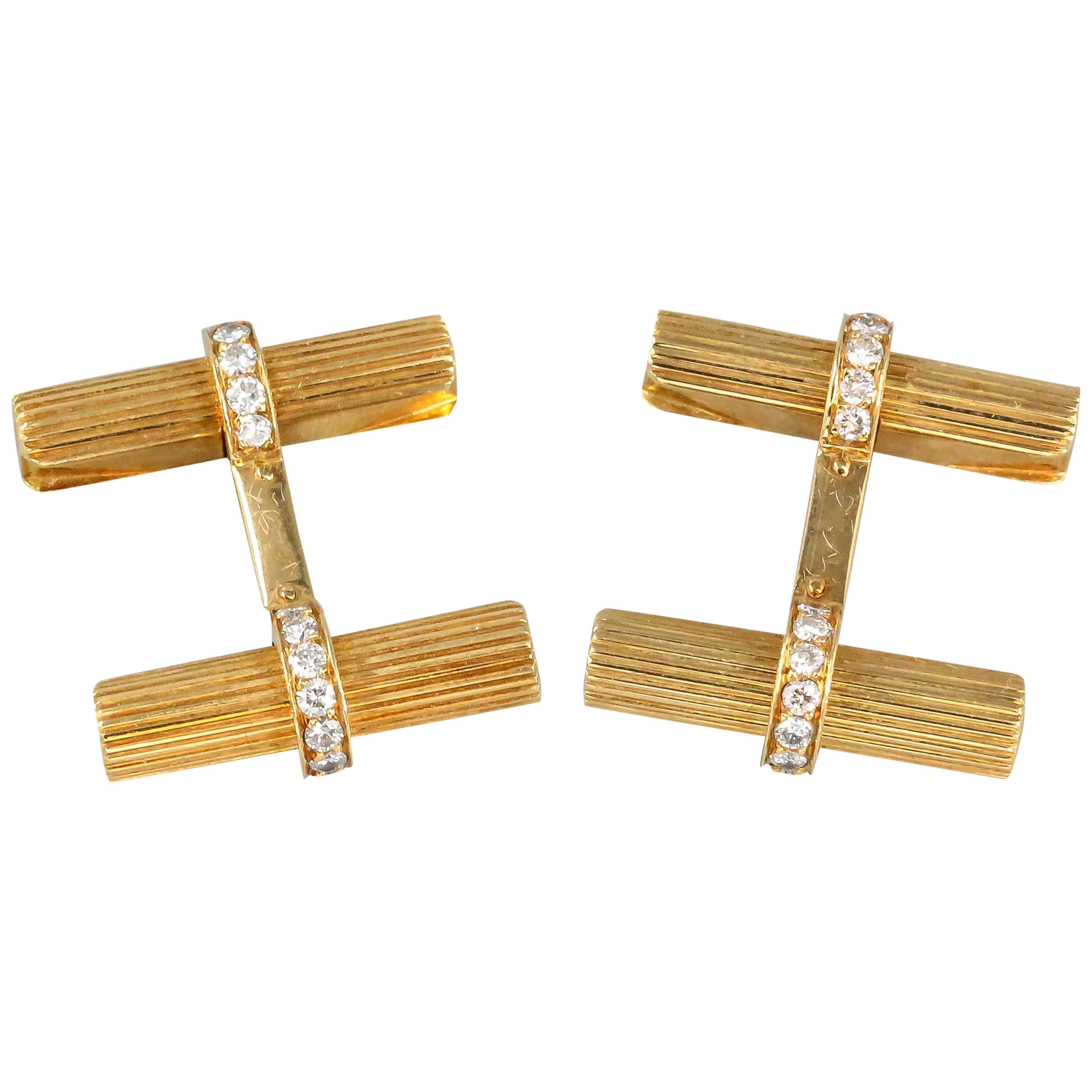 Handsome diamond, 18K yellow gold bar cufflinks and 3 studs set by Van Cleef & Arpels, circa 1970s. They feature high grade round brilliant cut diamonds and the bars can be removed to fit other bars of different materials if available. Expertly