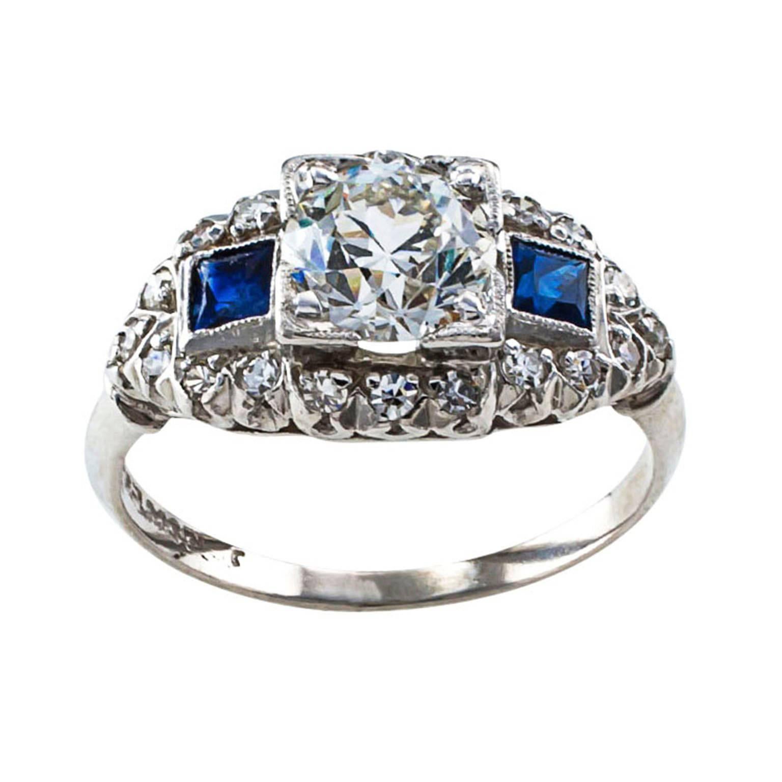.92 Carat Diamond and Sapphire Art Deco Engagement Ring

The Real Thing! Genuine late Art Deco engagement ring displaying emerging changes in design gravitating to the modernist and lavish lines that would become known as Retro and Mid Century. 