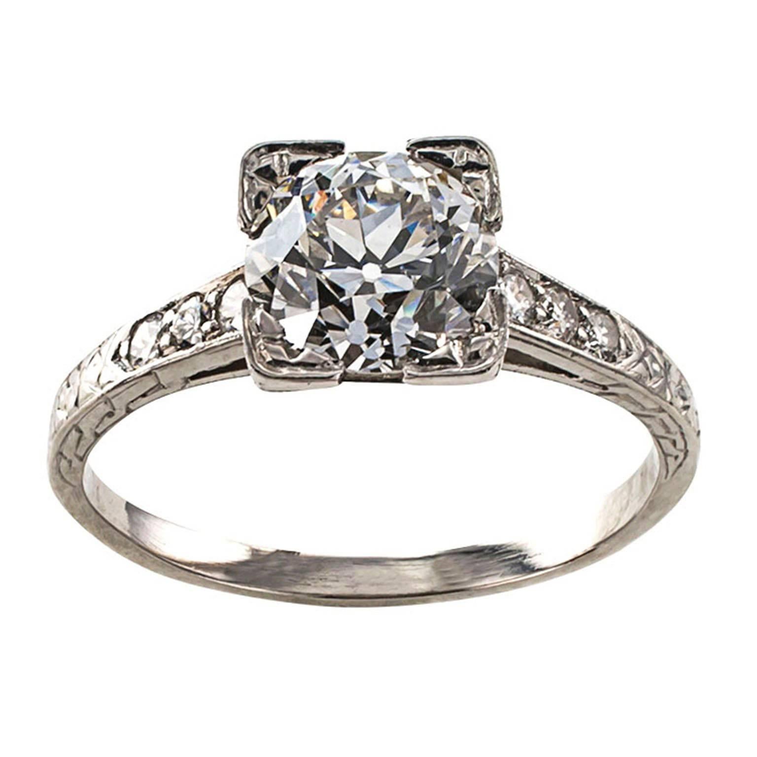 1.39 Carats Diamond Art Deco Engagement Ring Circa 1925

Authentic platinum Art Deco engagement ring centering upon an old European-cut diamond of exceptional color and clarity for the period.  And if you must have a diamond bigger than a carat,