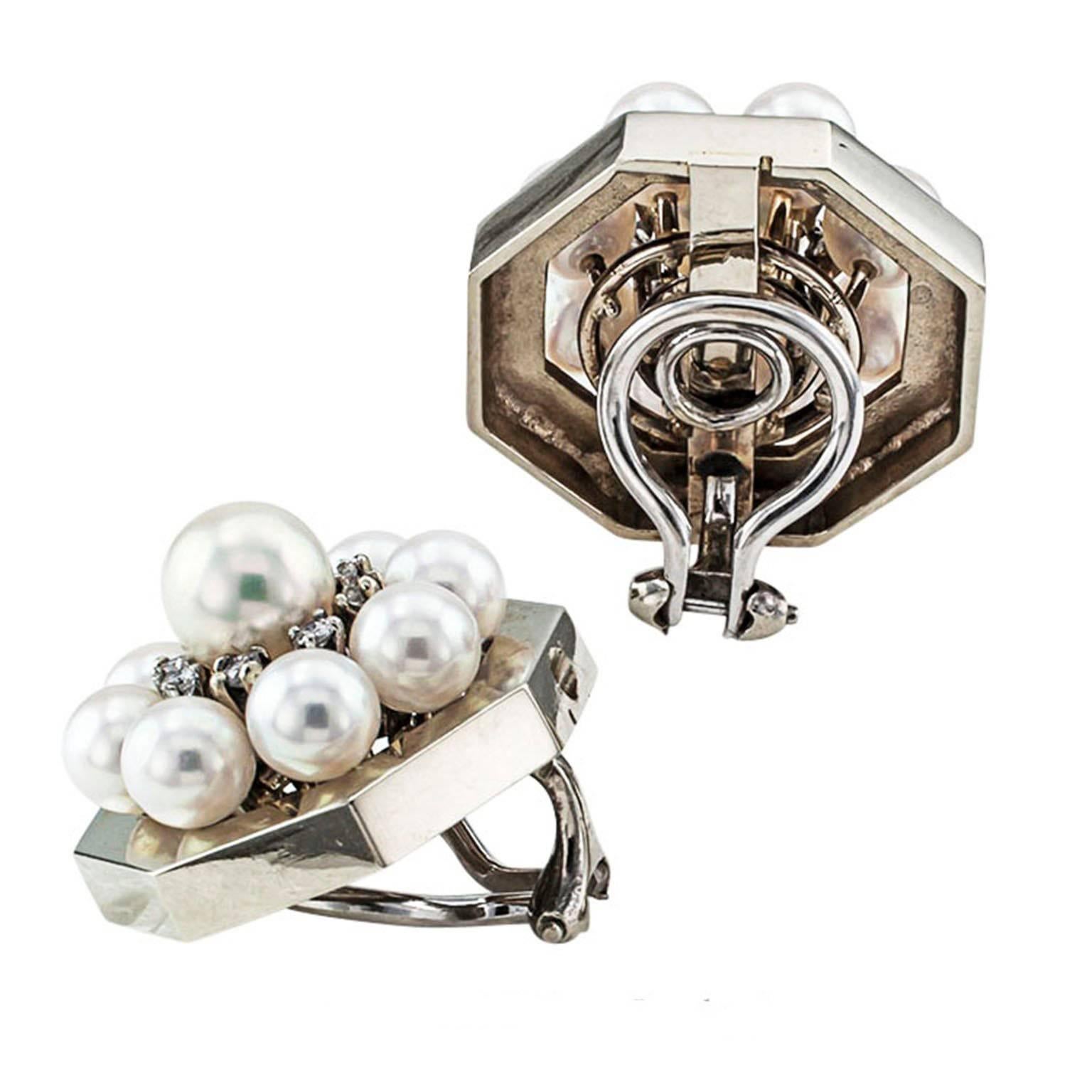 Mid-Century Cultured Pearl and Diamond Octagonal Earrings

The classic octagonal earring design gloriously elevated by a circular motif centering upon a 7 mm cultured pearl ringed by a course of prong-set diamonds framed by 5 mm cultured pearls. 