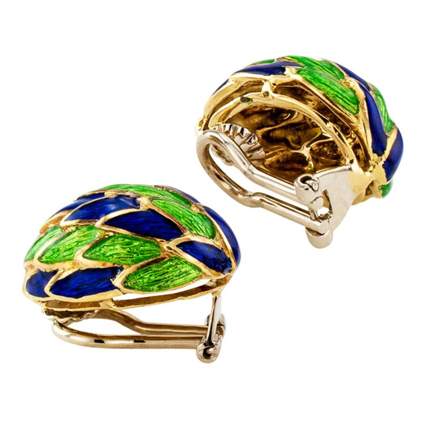 Blue and Green Enamel  Earrings Circa 1970

A whimsical play between colors and patterns give these conical shaped ear clips a most distinctive look.  Classic blue and green, both neutral and easy to coordinate with other colors in the wardrobe to