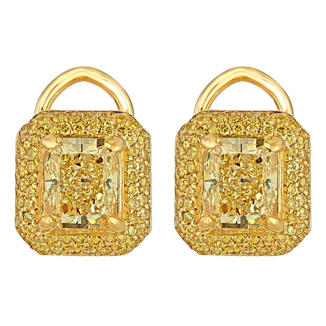 Two Yellow Radiant Diamonds Set in Gold Earring Mountings