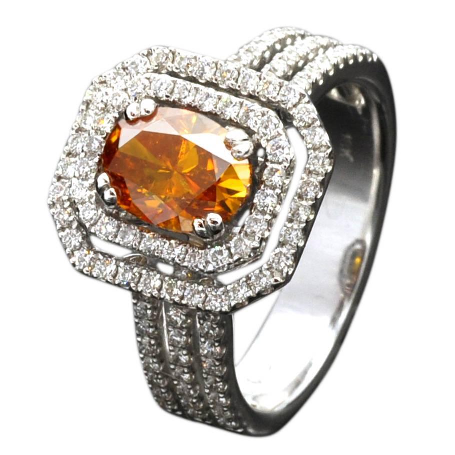 A natural Fancy Intense yellowish Orange diamond weighing 1.34 carat ( HRD certified) set in a white gold ring alongside with 0.70 carat of white diamonds
The Orange color is definitely the dominant color of the center stone while a hint of yellow