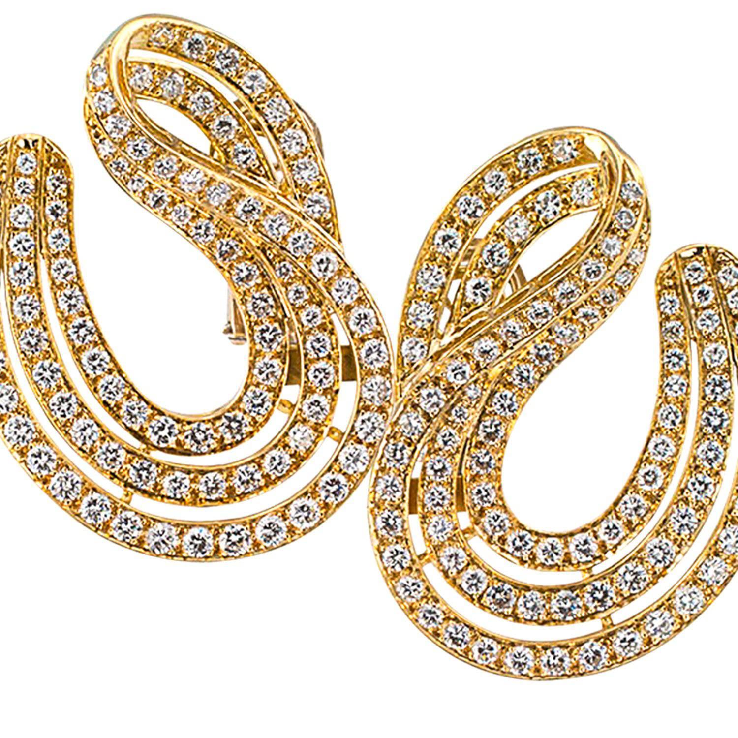 6.50 Carats Diamond and 18 Karat Yellow Gold Earrings

No question about it, these are good looking large earrings.  Wearing them is like walking around with sunshine radiating from your ears.  The diamonds are so bright and beautiful in every sense