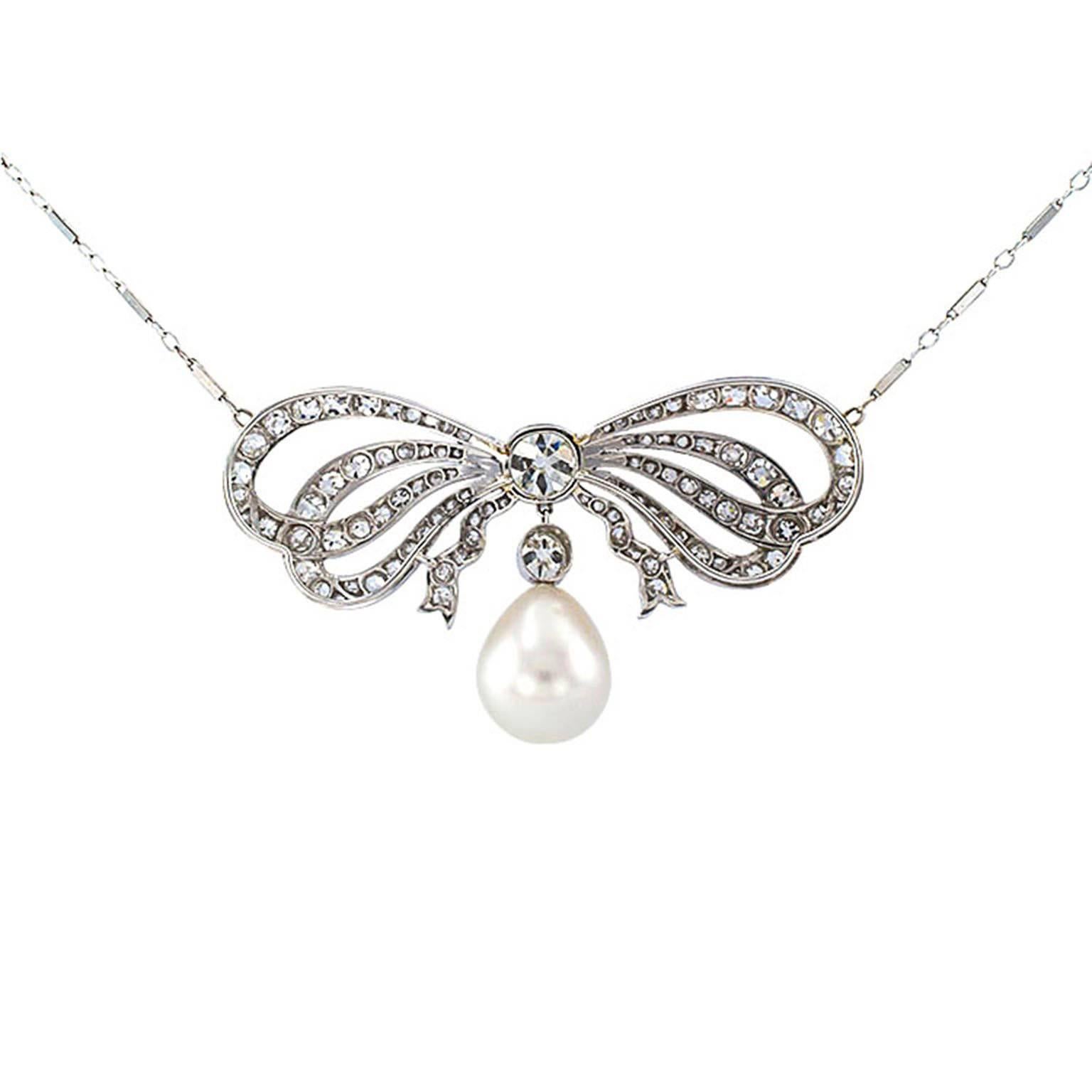 Edwardian Diamond and South Sea Pearl Bow Necklace

Centering upon a nice old Mine Cushion cut diamond weighing approximately 1.00 carat, approximately I - J color and VS clarity, tied up with a voluminous platinum bow, set with approximately 3.10