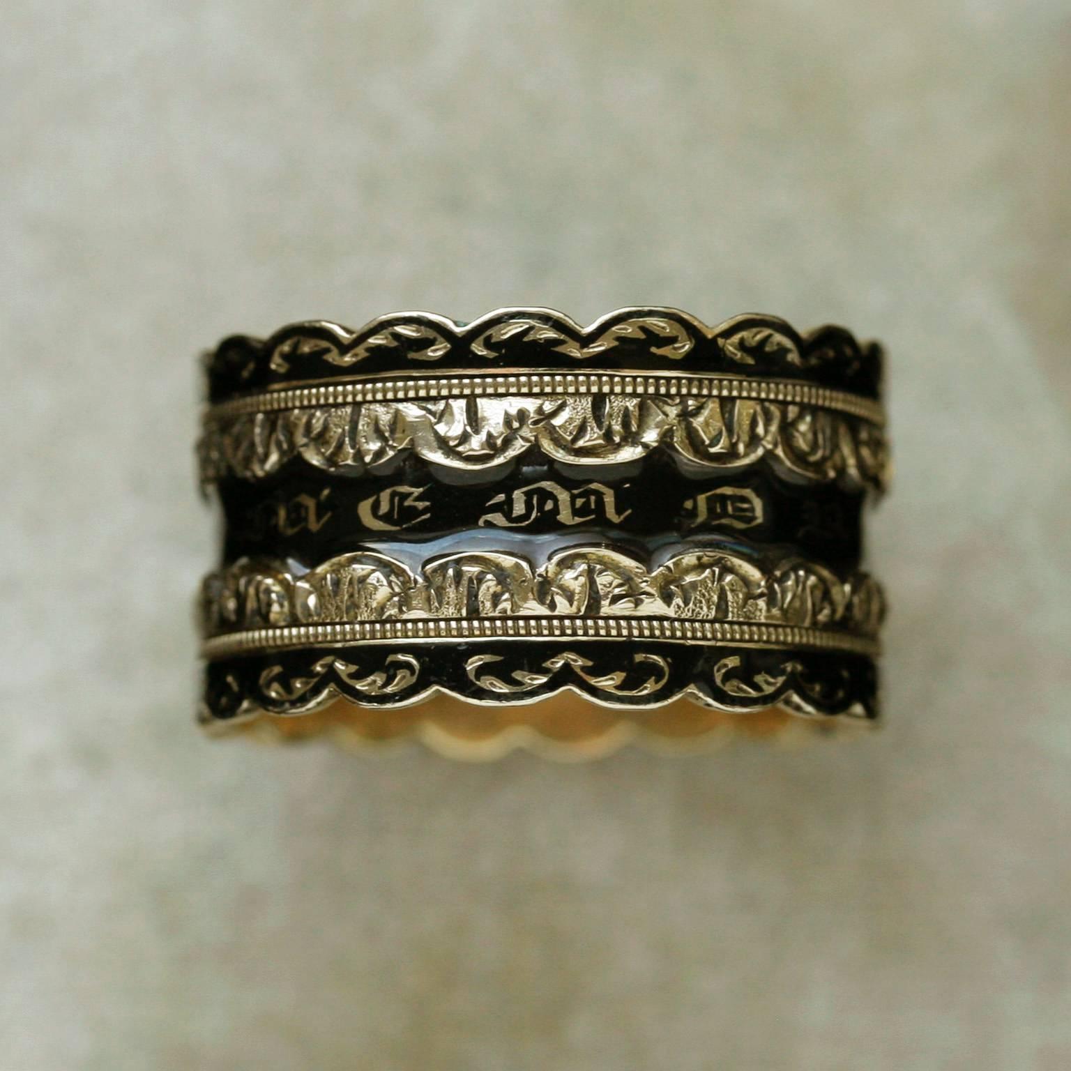 C.1831. A gorgeous black enamel wide mourning ring.  The ring has 'in memory of' gothic script. The inner band engraving shows; T.J. Allen Esq. The ring contains the full English hallmarks : WK (makers mark), 18k, London 1831. 

US Size: 9.5 
Width:
