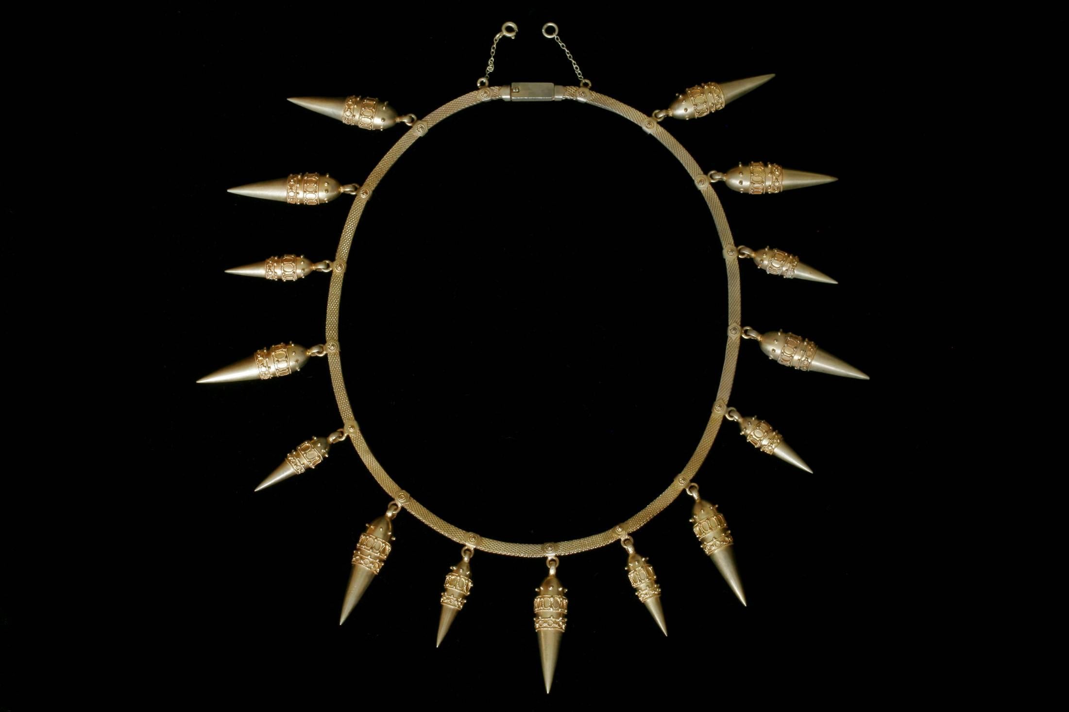 A very impressive and rare Victorian Etruscan revival collar. The necklace contains 15 beautiful amphorae around the neckline. An amphora is a motif from the ancient Greek and Etruscan civilizations that was widely and fashionably used in the