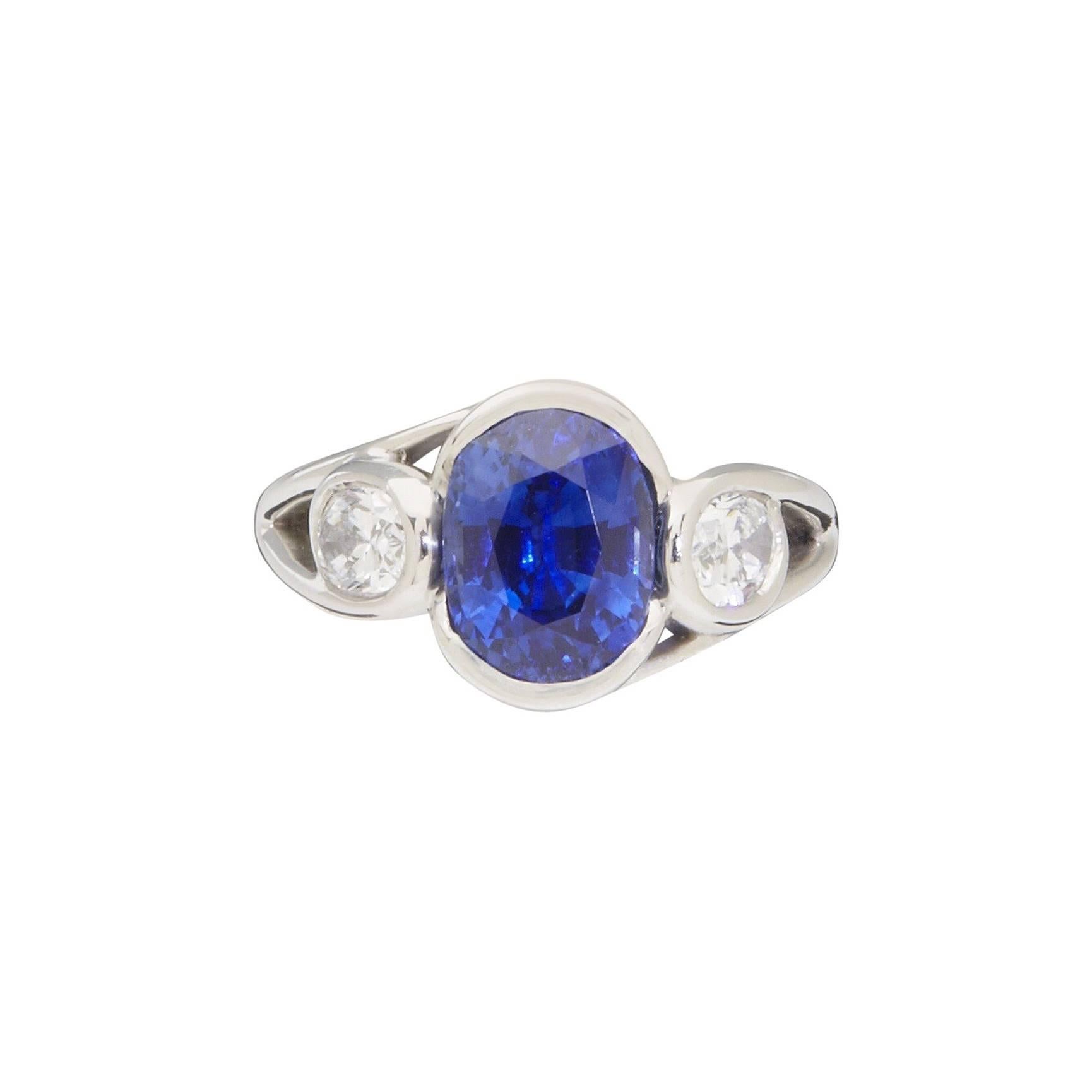 Faceted Oval Sapphire and Diamond Platinum Ring For Sale
