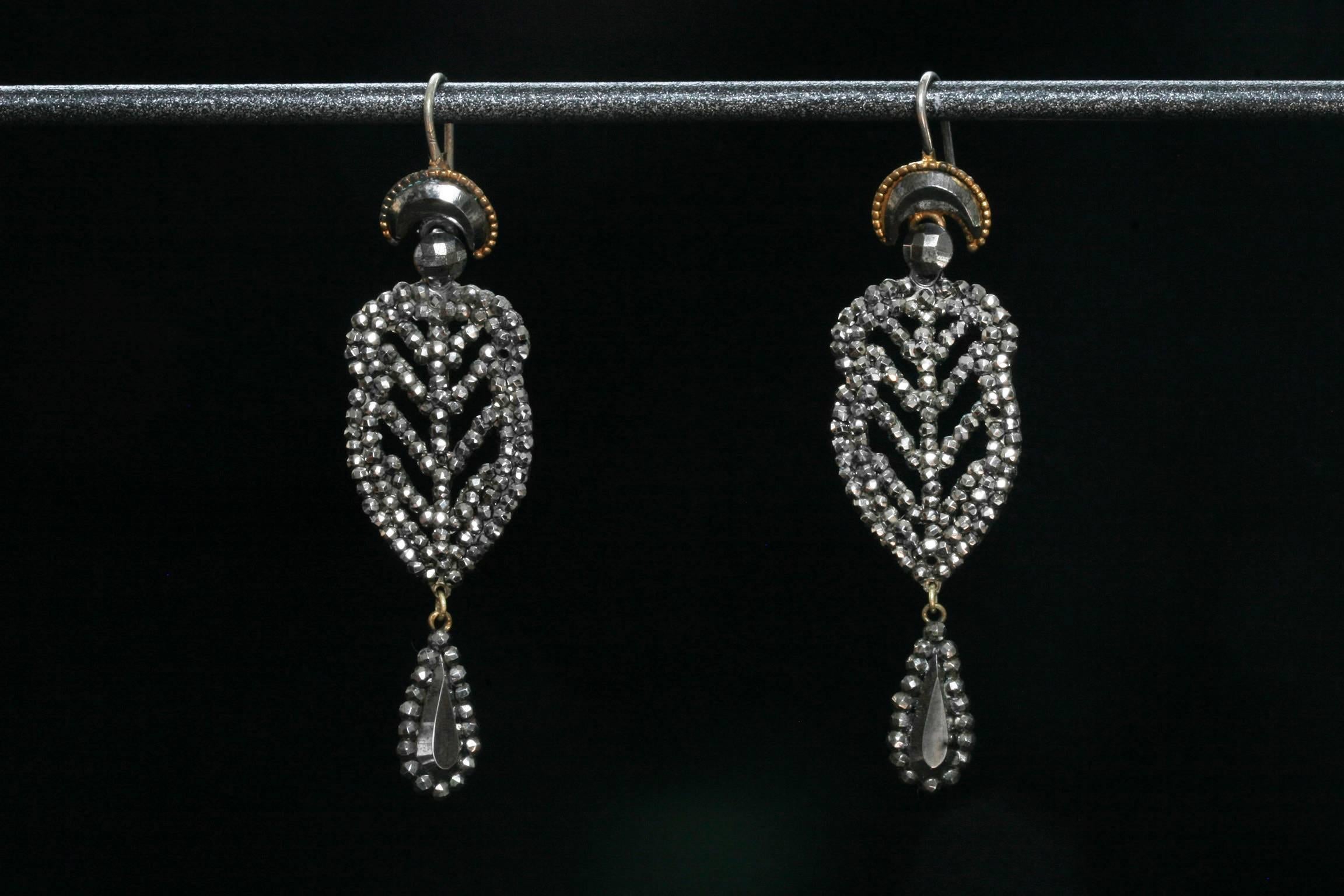 C.1800-1810.  A pair of very finely made cut steel drop earrings.

Cut steel jewelry was introduced in the Georgian era around the mid-1700s. This particular type of jewelry is made with polished steel-faceted studs to create a beautiful, dazzling