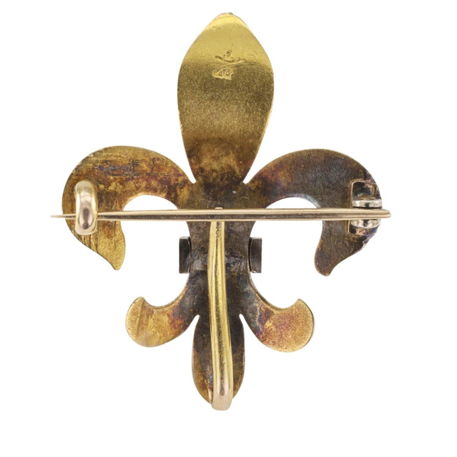 Rikers Victorian Fleur de Lis Brooch

Victorian fleur de lis brooch, circa 1895, mounted in 14-karat gold with pearls, maker's marks for Rikers. The sculptural design features a watch hook on the back and a wonderful patina that emphasizes the