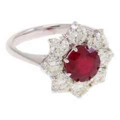 ct 2, 20 Ruby and ct 2, 02 Diamond Flower Ring
