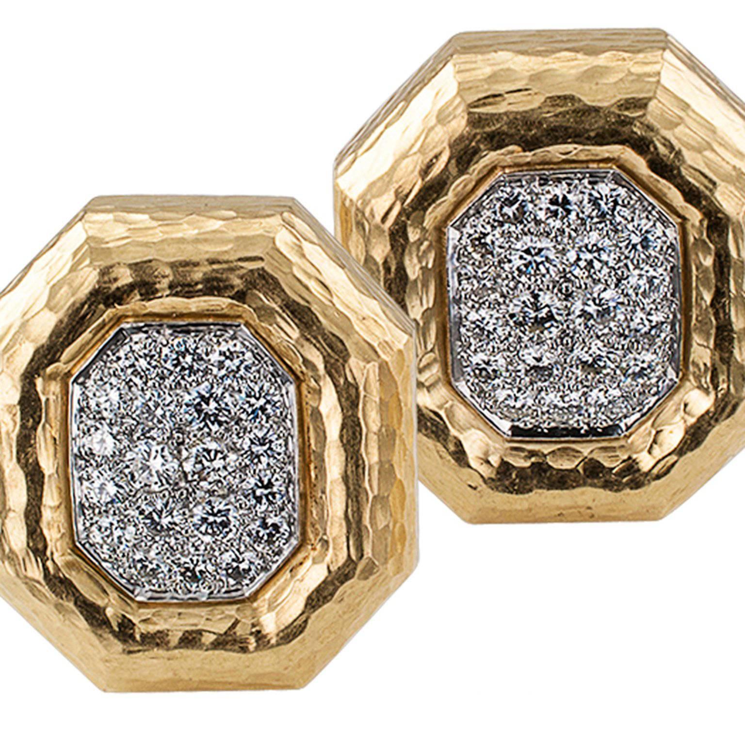 Andrew Clunn Octagonal Diamond Earrings

   Andrew Clunn octagonal diamond ear clips mounted in 18-karat gold and platinum circa 1980.  The pure form designs feature textured gold borders framing conforming platinum plaques set with diamonds
