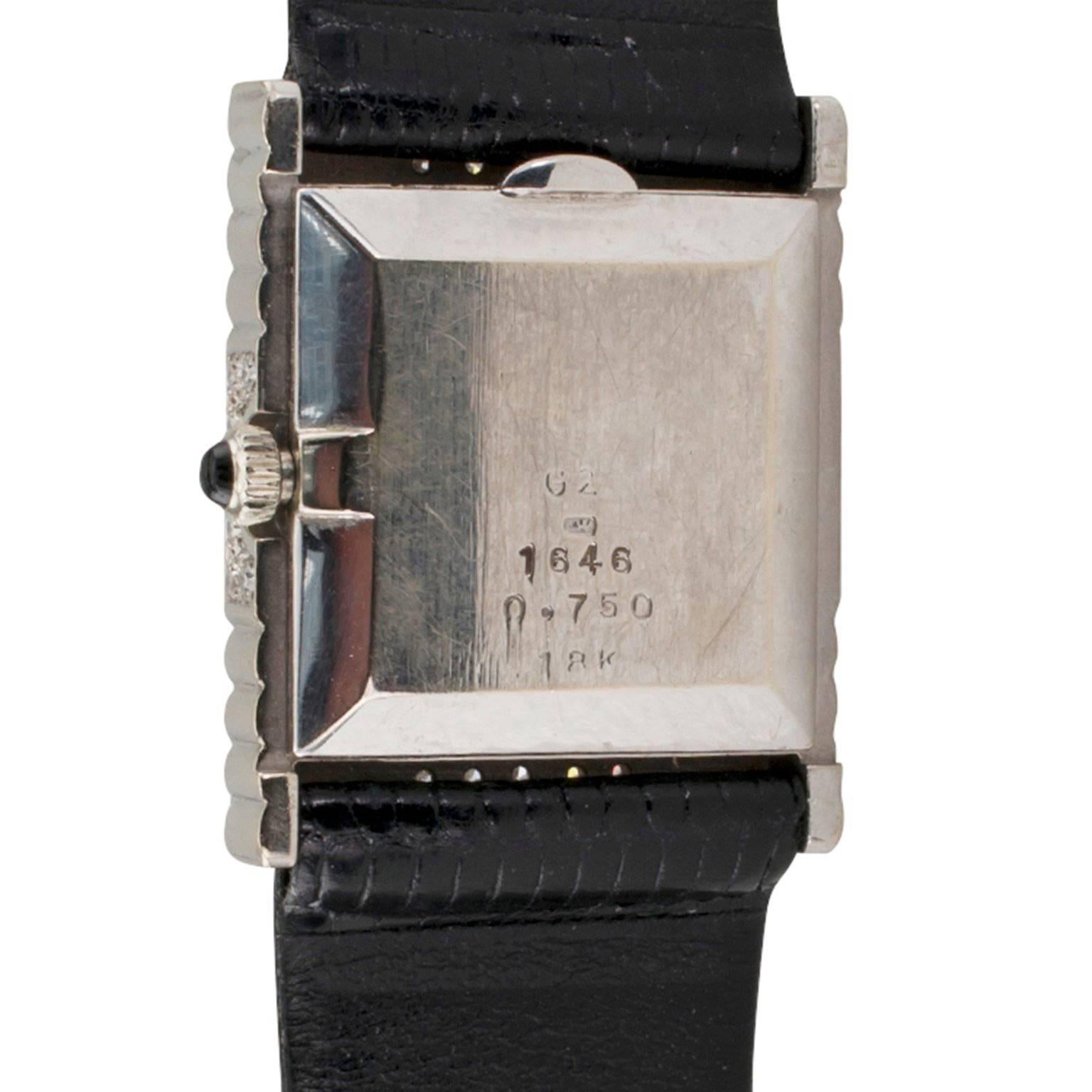 DeLaneau White Gold Diamond Tuxedo Wristwatch

DeLaneau 18-karat white gold and diamond tuxedo wristwatch circa 1970.  The geometric rectangular designed case is pave set with diamonds totaling approximately 1.00 carat, and the square black dial is