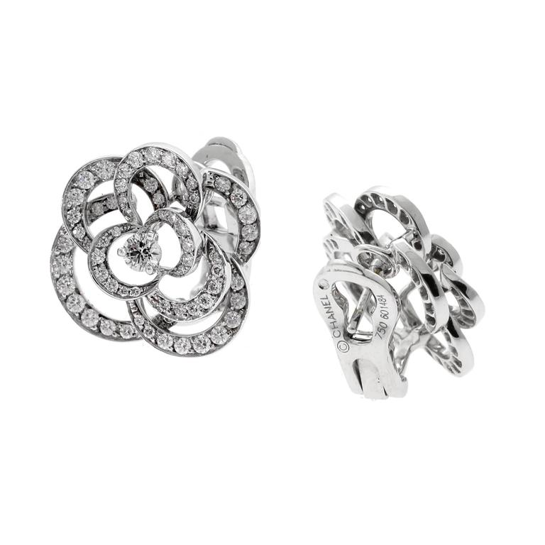 CHANEL: A PAIR OF 18K WHITE GOLD AND DIAMOND CAMELLIA STUD EARRINGS in  United States