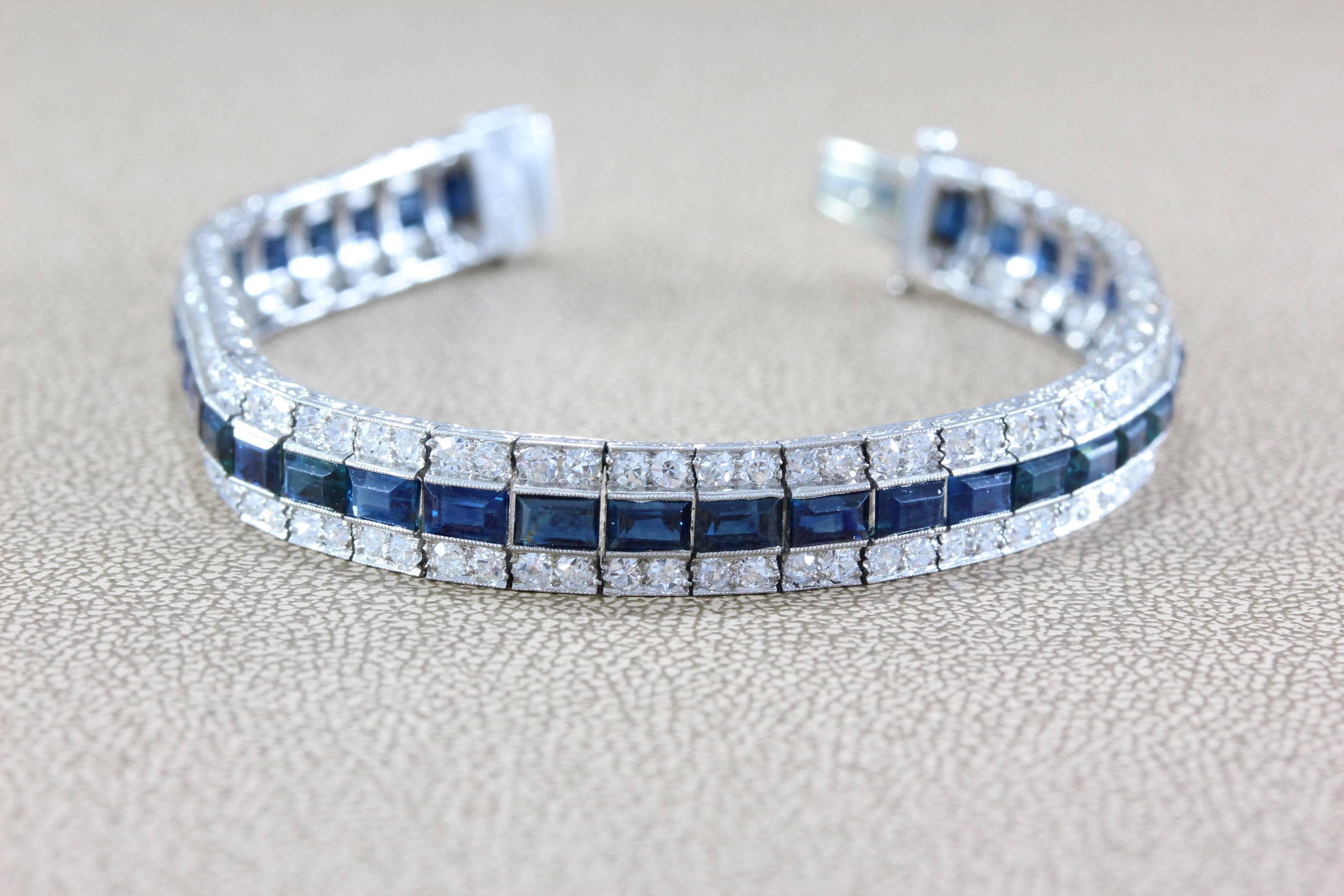 This stunning Art Deco bracelet features 3.10 carats of diamonds complemented by 3.90 carats of square cut sapphire all set in platinum with a beautiful scroll motif on the sides of the bracelet.

Dimensions: 6.50 x 0.25 inches