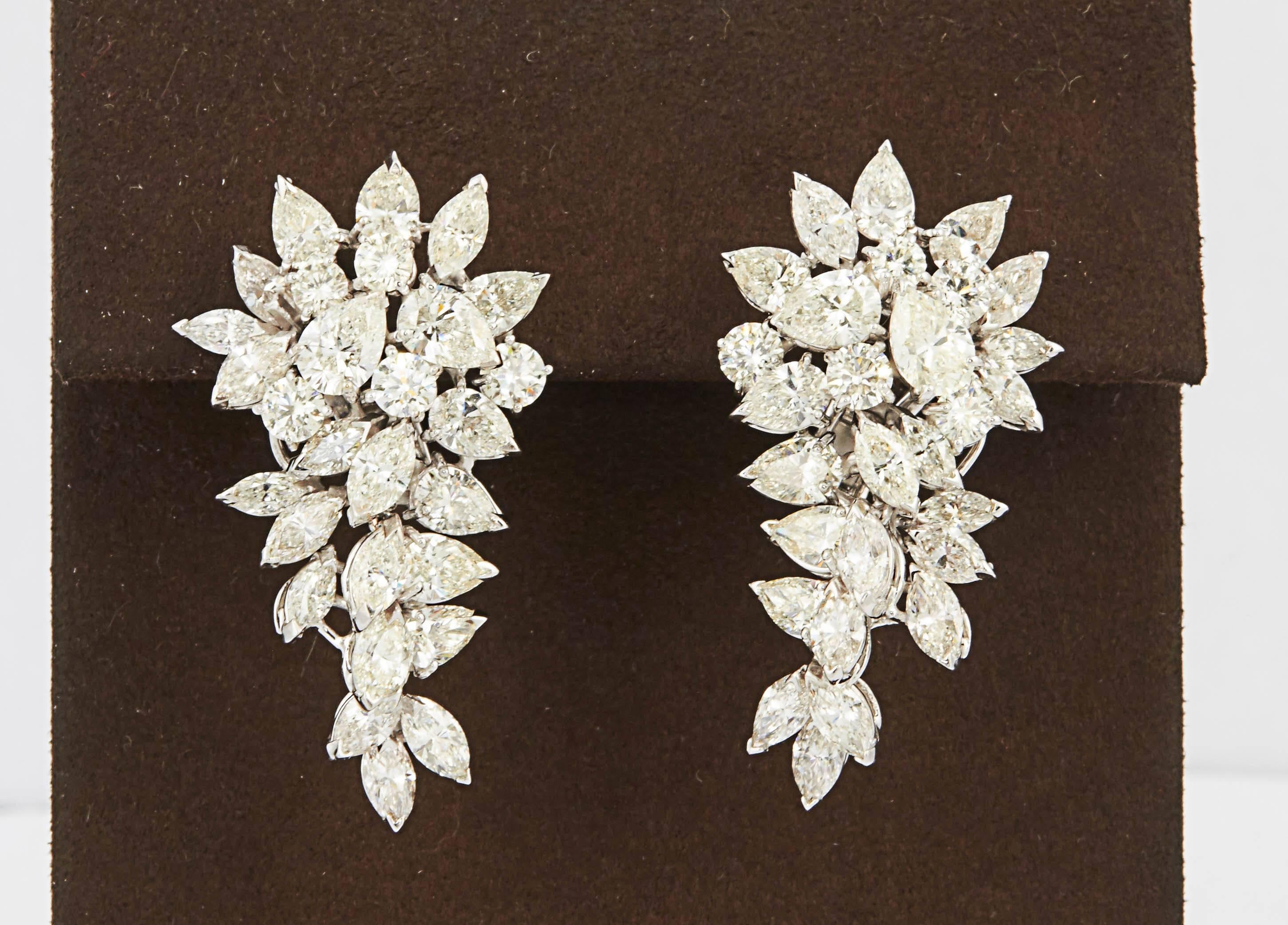 

A substantial cluster earring with beautiful movement. 

18.02 carats of diamonds F/G VS set in 18k white gold. 

Made in Italy, this earring features round, pear and marquise shaped diamonds of various sizes. The diamonds are set at different