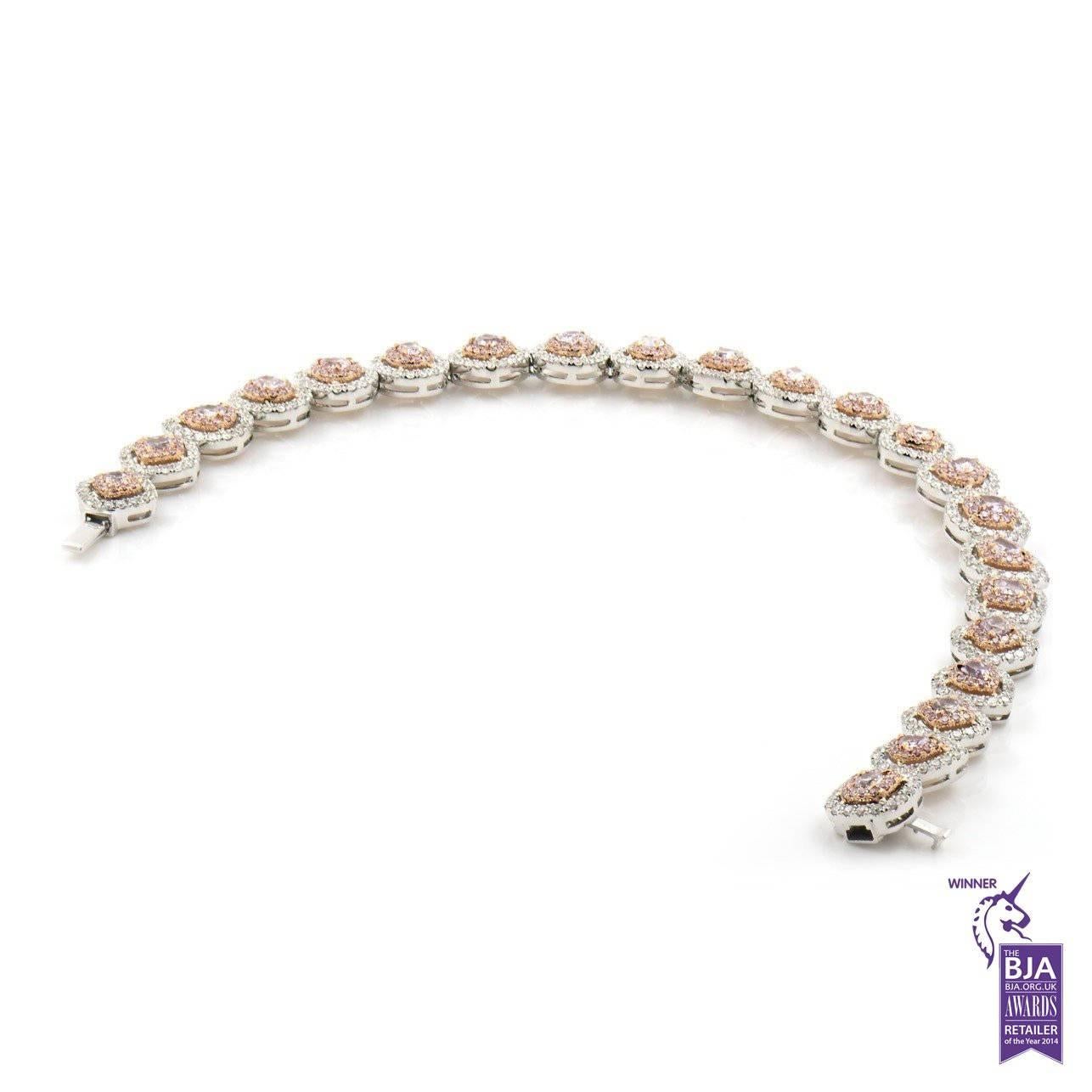 FANCY PINK DIAMOND BRACELET - 5.44 CT

Set in 18Kt White gold


Total pink diamond mix cut weight: 2.05 ct
[22 diamonds ]
Color: Fancy pink
Clarity: VS

Total pink diamond round cut weight: 0.94 ct
[ 285 diamonds ]
Color: Fancy intense pink
Clarity: